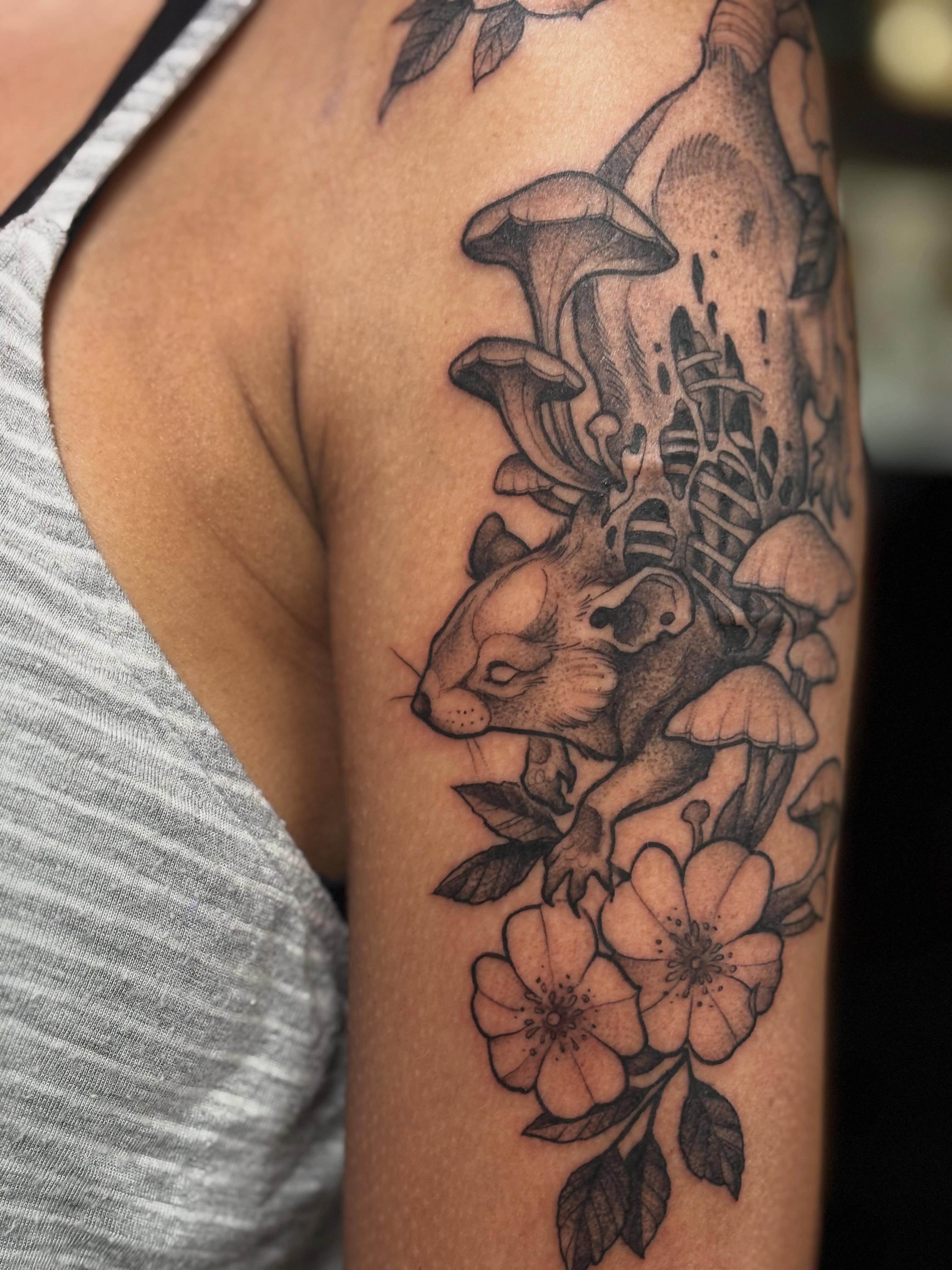 Squirrel and flowers realism tattoo on the forearm by Alex