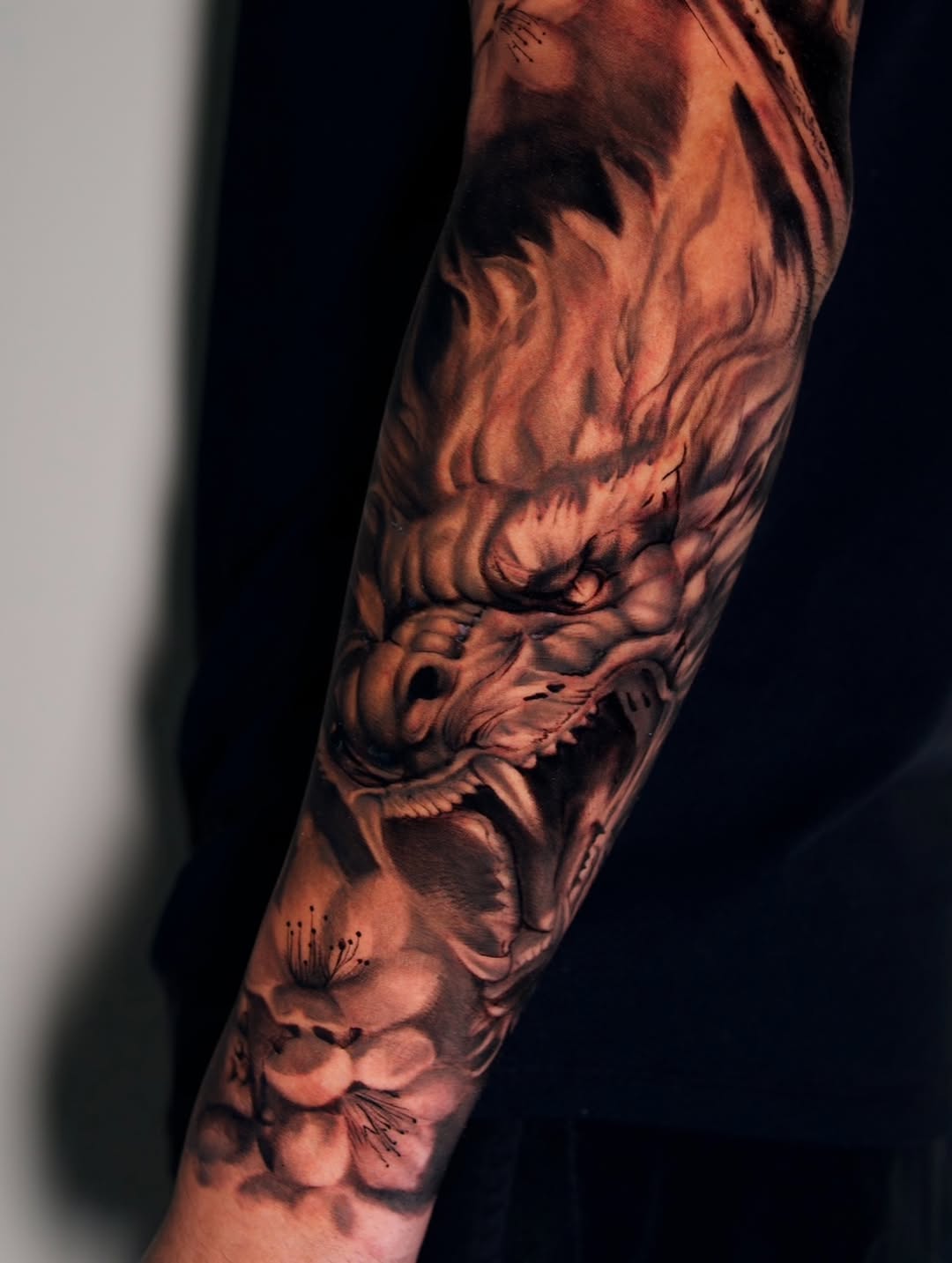 Dragon head and flowers Japanese tattoo on the forearm by ᴅᴀʟʟᴀꜱ ᴛᴀᴛᴛᴏᴏ ᴀʀᴛɪꜱᴛ