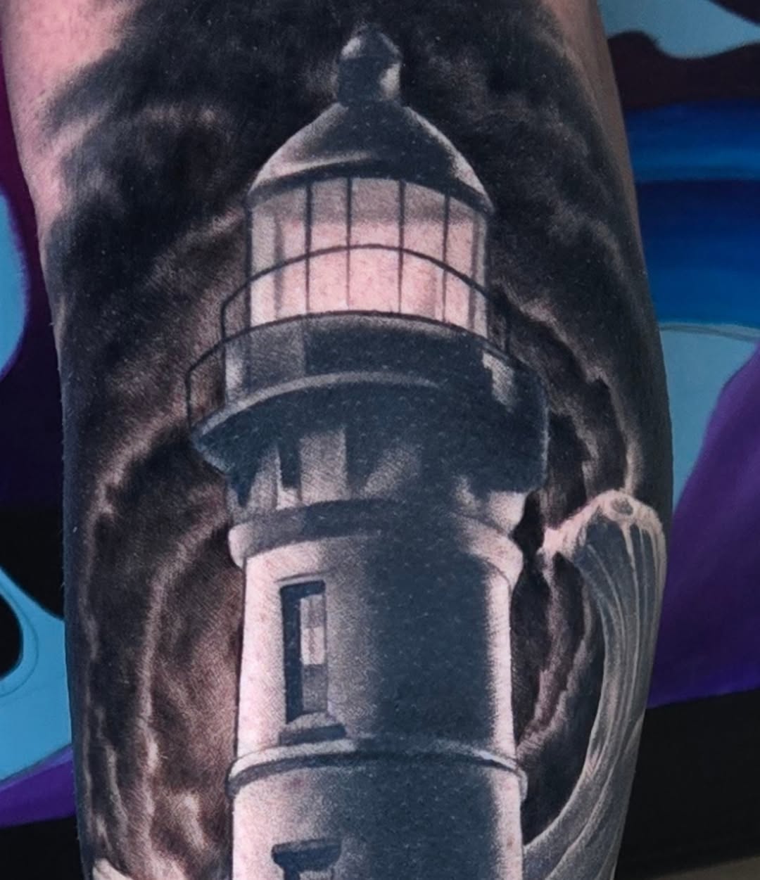 Lighthouse realism tattoo on the forearm by Jeff Stager