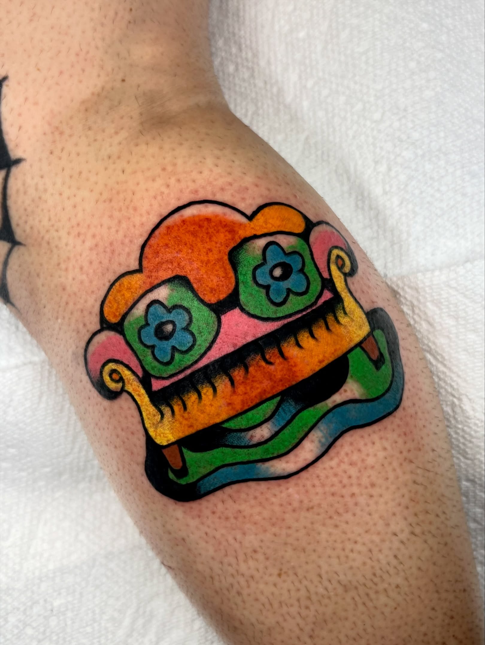 Monster Chicano tattoo on the forearm by Sierra Mack