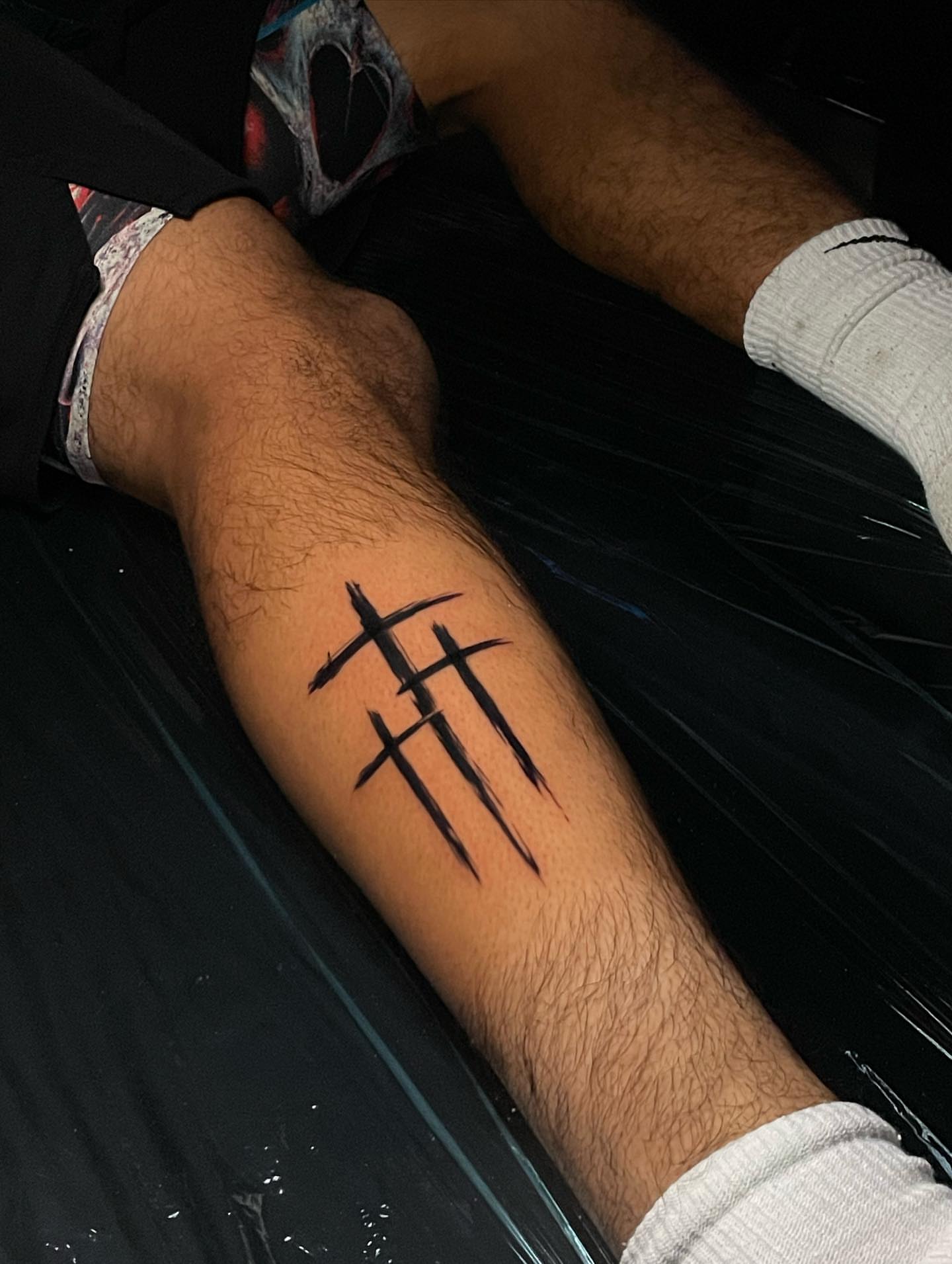 Crosses black and grey tattoo on the forearm by Nikko