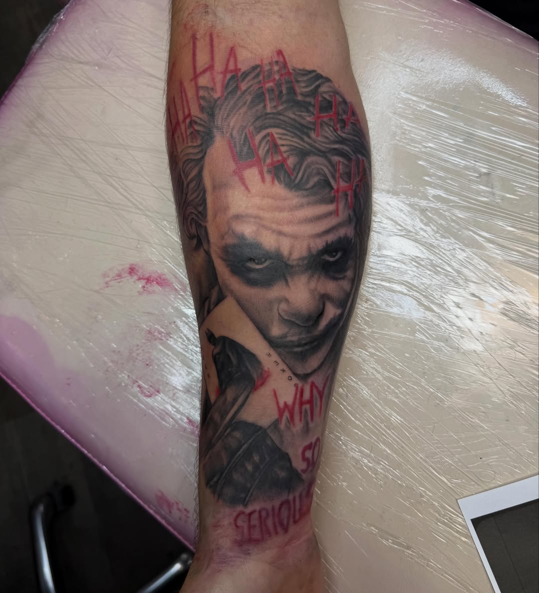 Joker realism tattoo on the forearm by Jordan Clifford