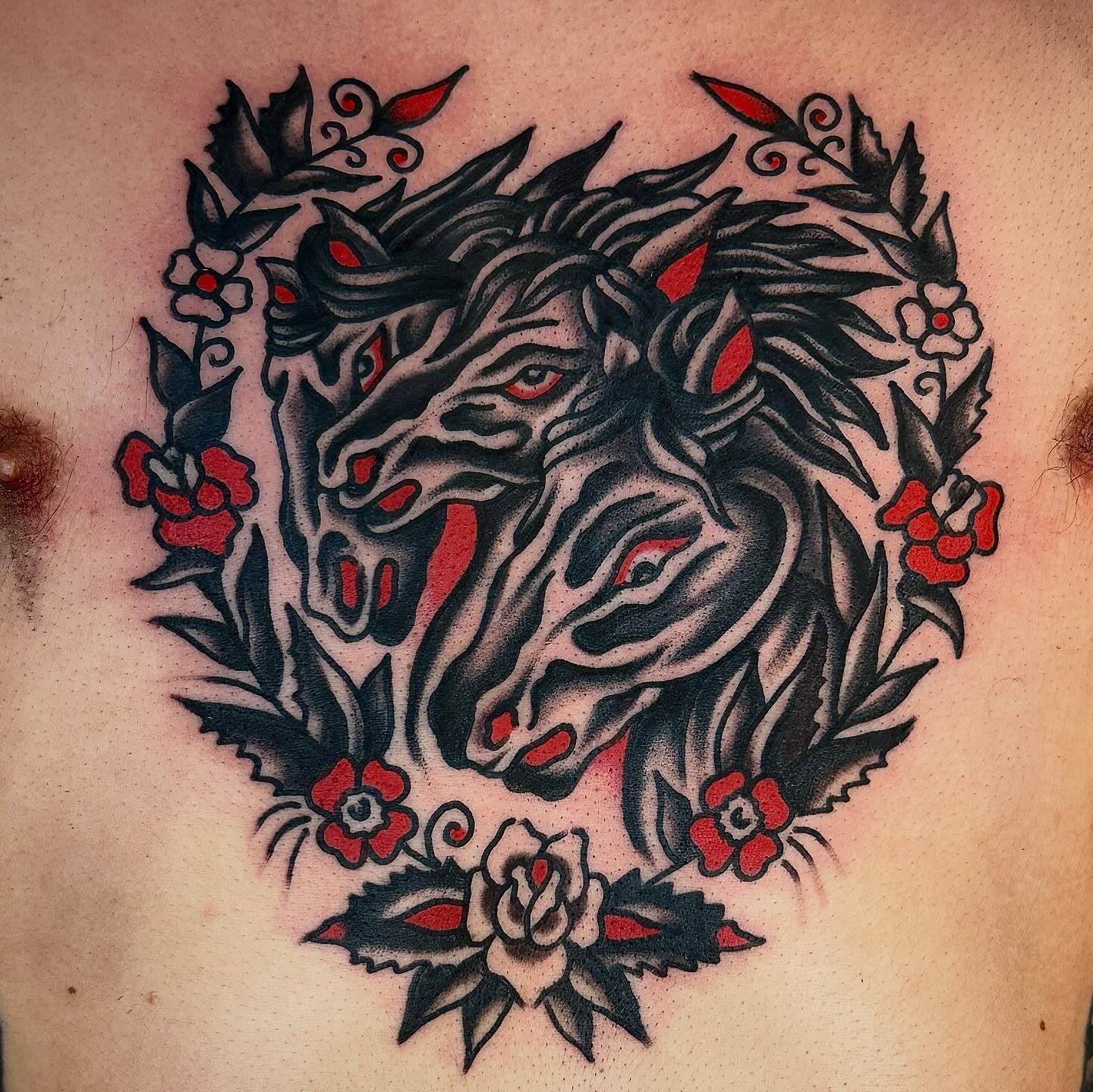 Horses and flowers American traditional tattoo on the chest by Jared Allen, Saint Petersburg, Florida