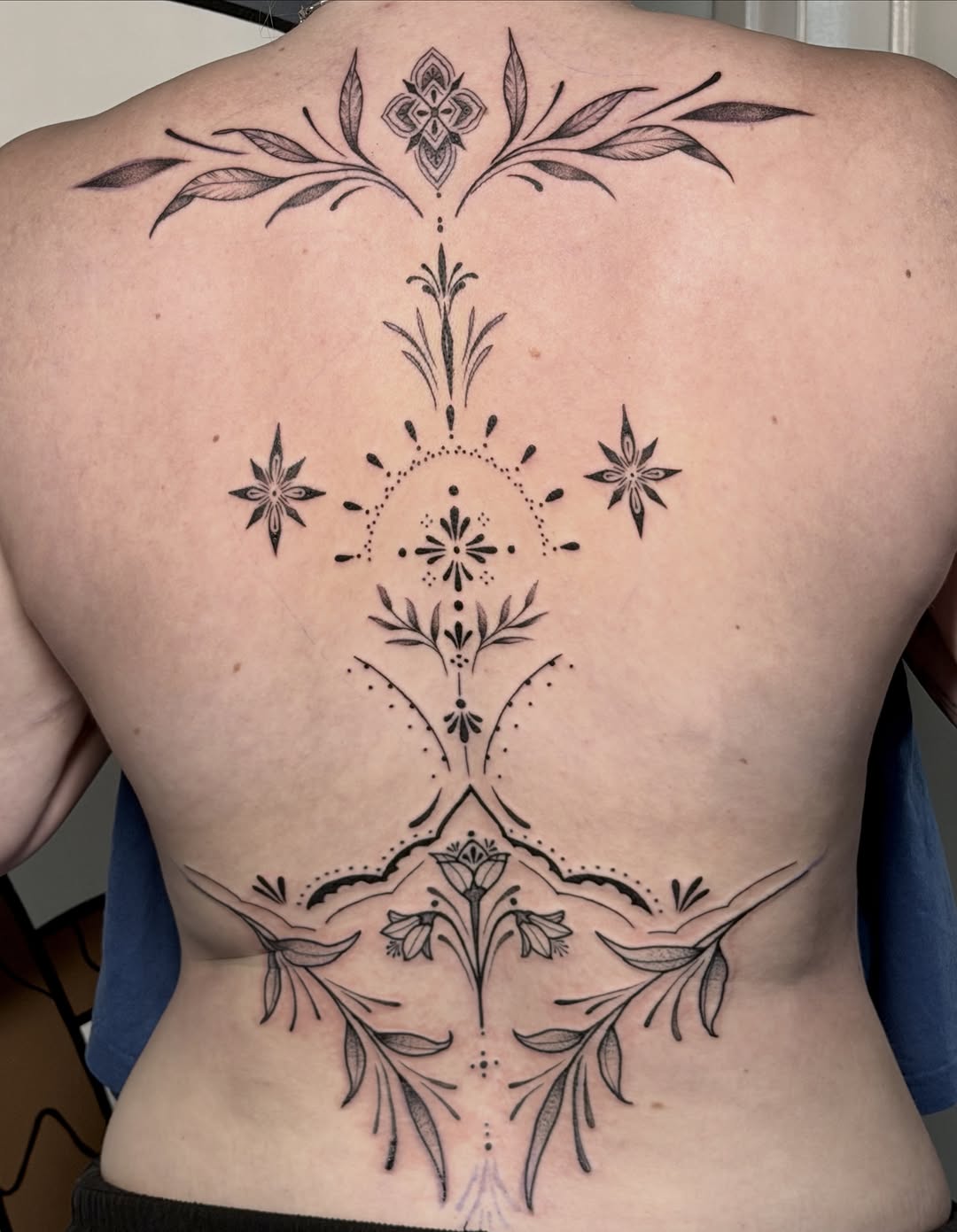 Ornamental floral back piece ornamental tattoo on the back by Sophia, New Carlisle, Ohio