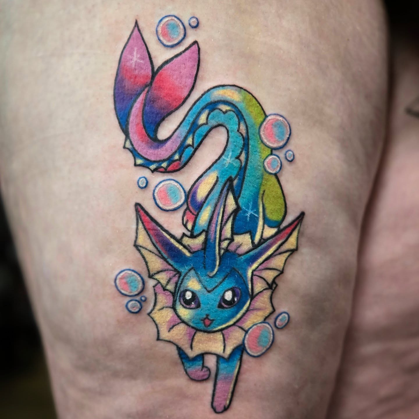 Vaporeon new school tattoo on the thigh by Destiny