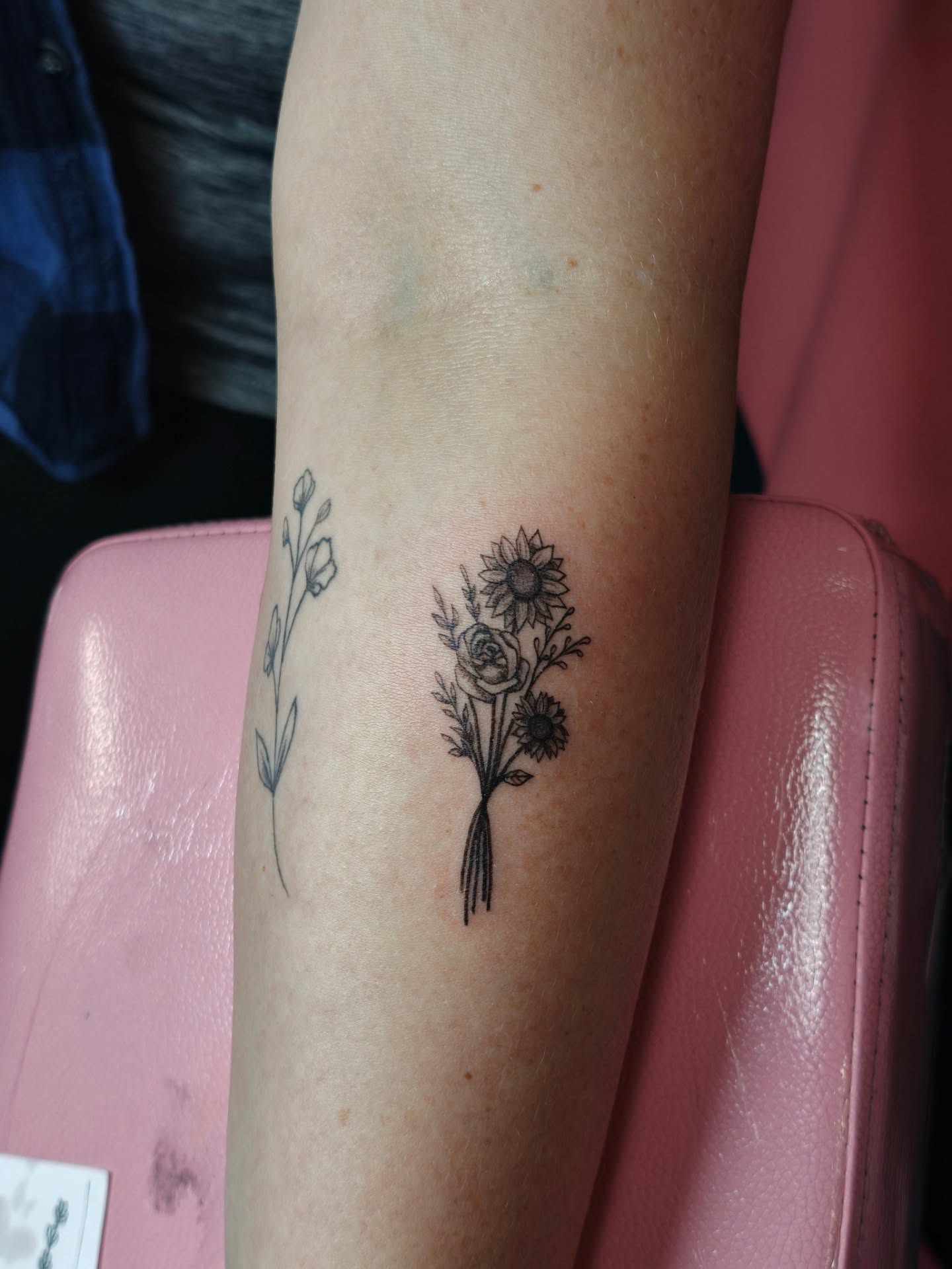 Flower bouquet black and grey tattoo on the forearm by Dani Sandoval, Anaheim, California