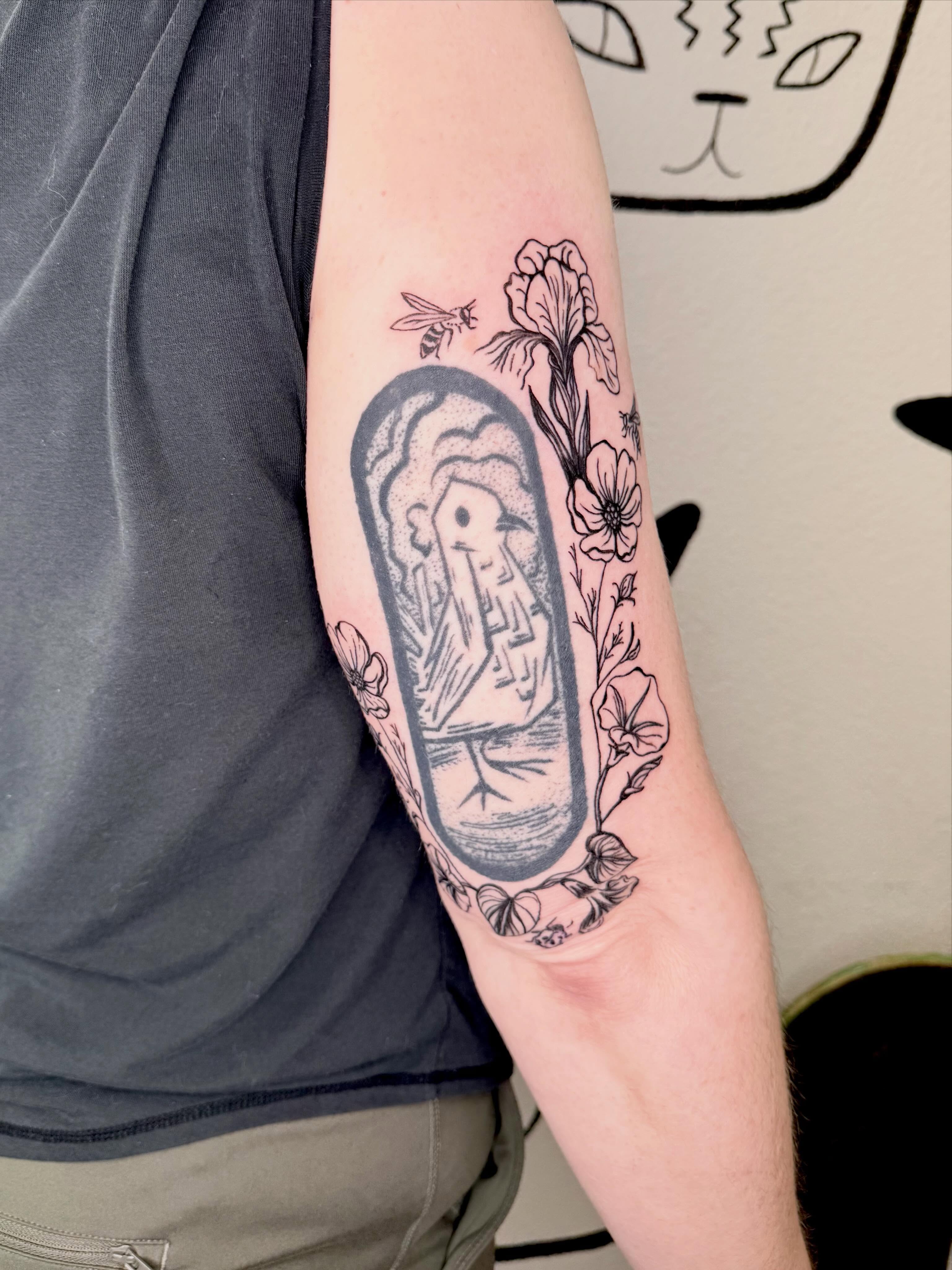 Mummy and flowers black and grey tattoo on the forearm by Peggy
