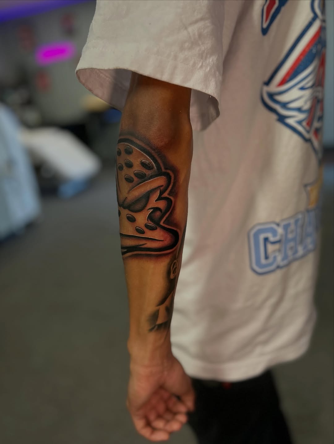 Hockey goalie mask realism tattoo on the forearm by Tattoo Artist