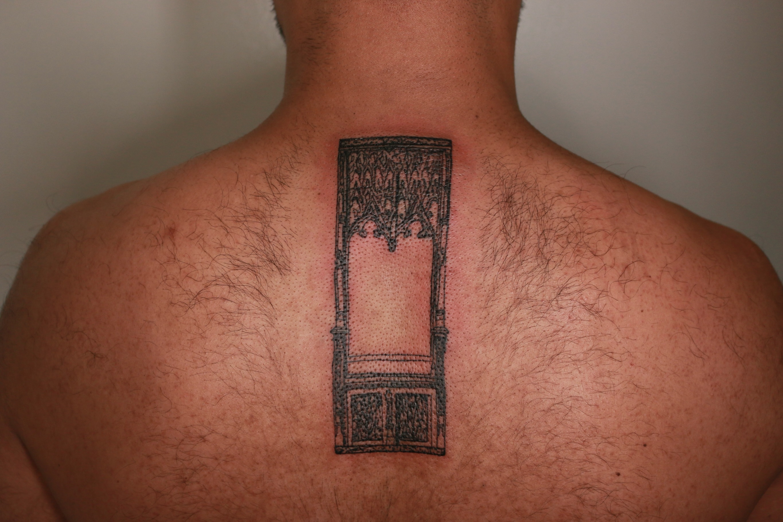 Door dotwork tattoo on the back by Mike