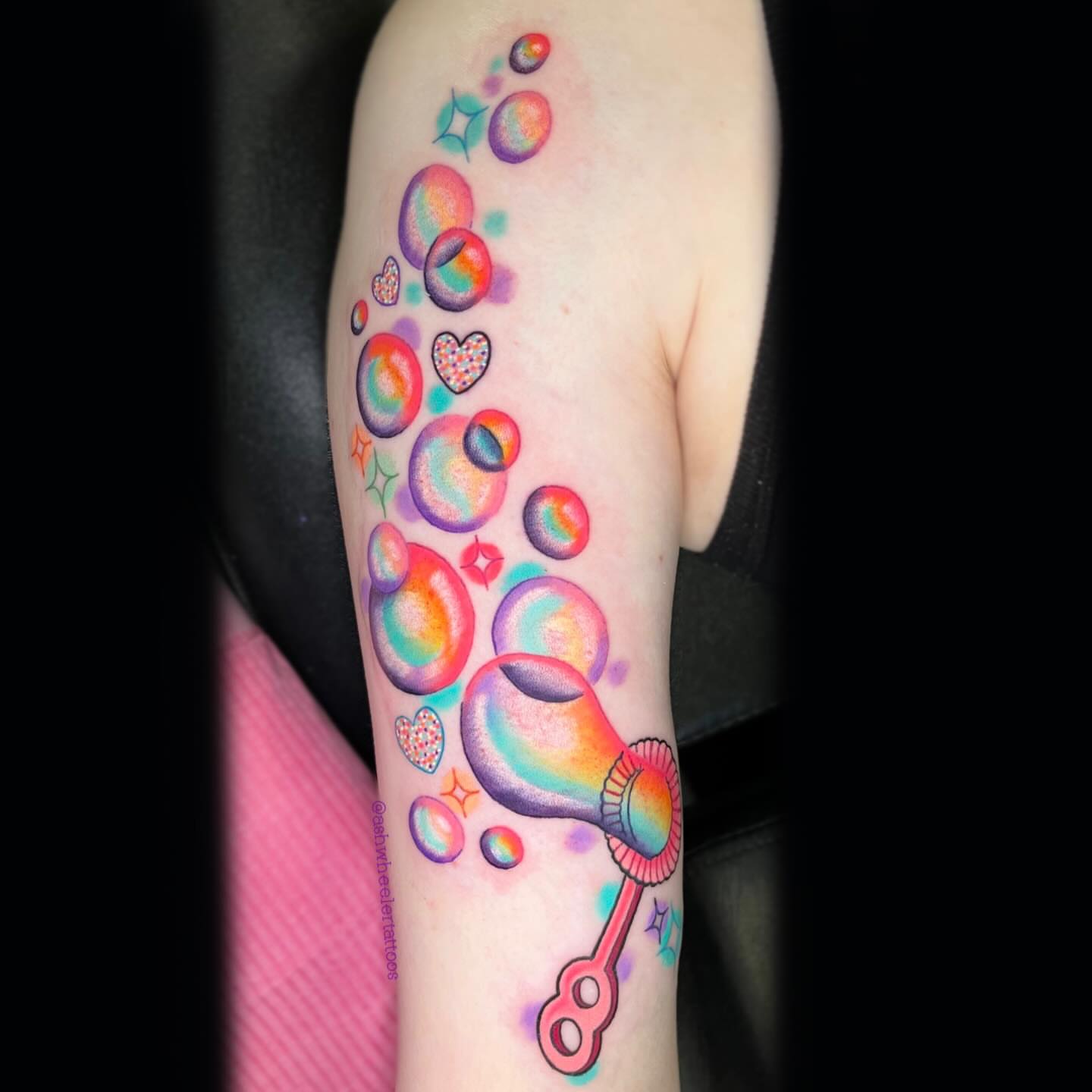 Bubble wand new school tattoo on the forearm by Ash Wheeler