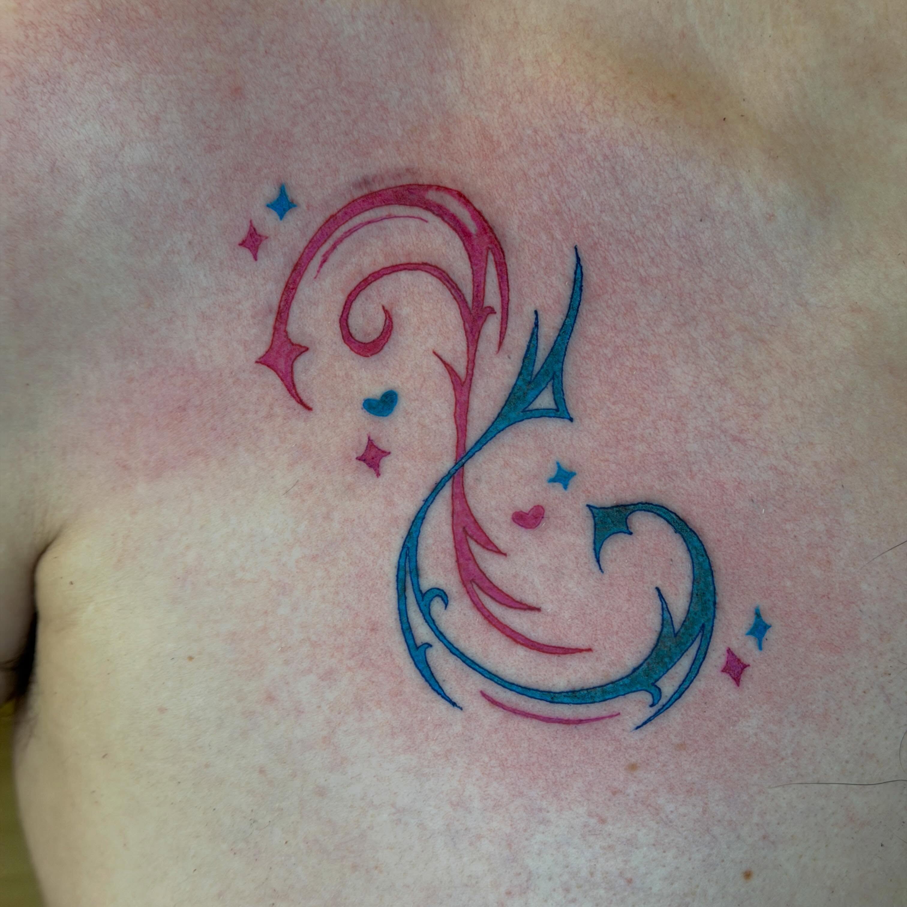 Swirls and hearts new school tattoo on the chest by Stvn Geyer, Urbandale, Iowa
