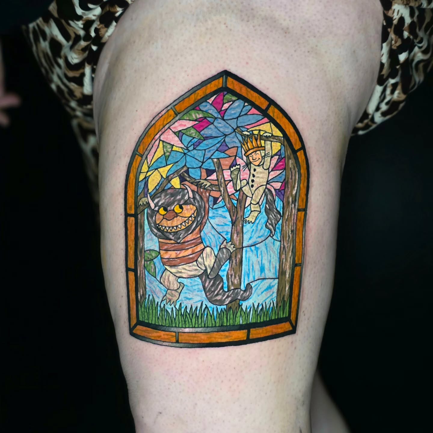 Stained glass window illustrative tattoo on the thigh by Banana Cake