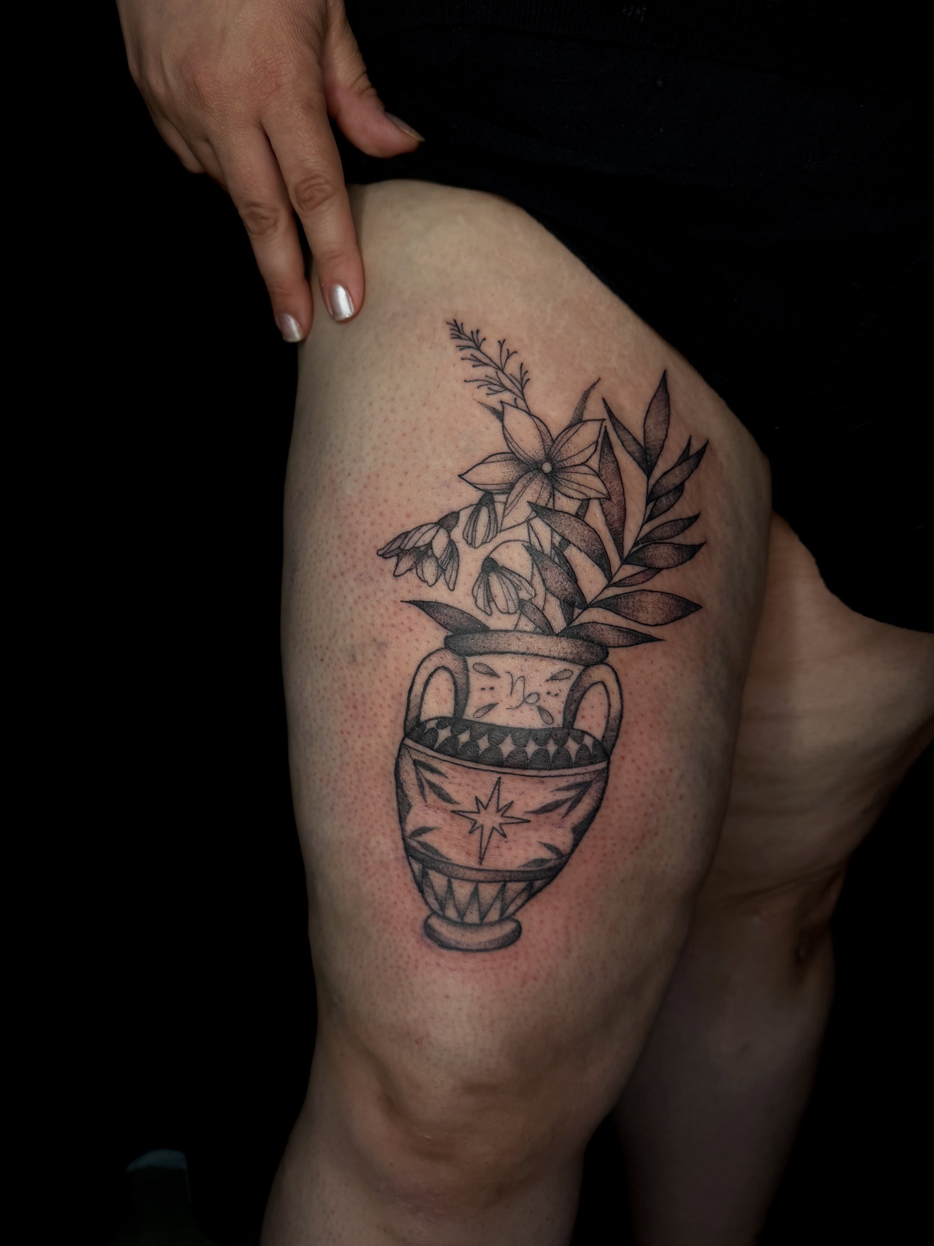 Urn with flowers black and grey tattoo on the thigh by ✧˖°. Jordan