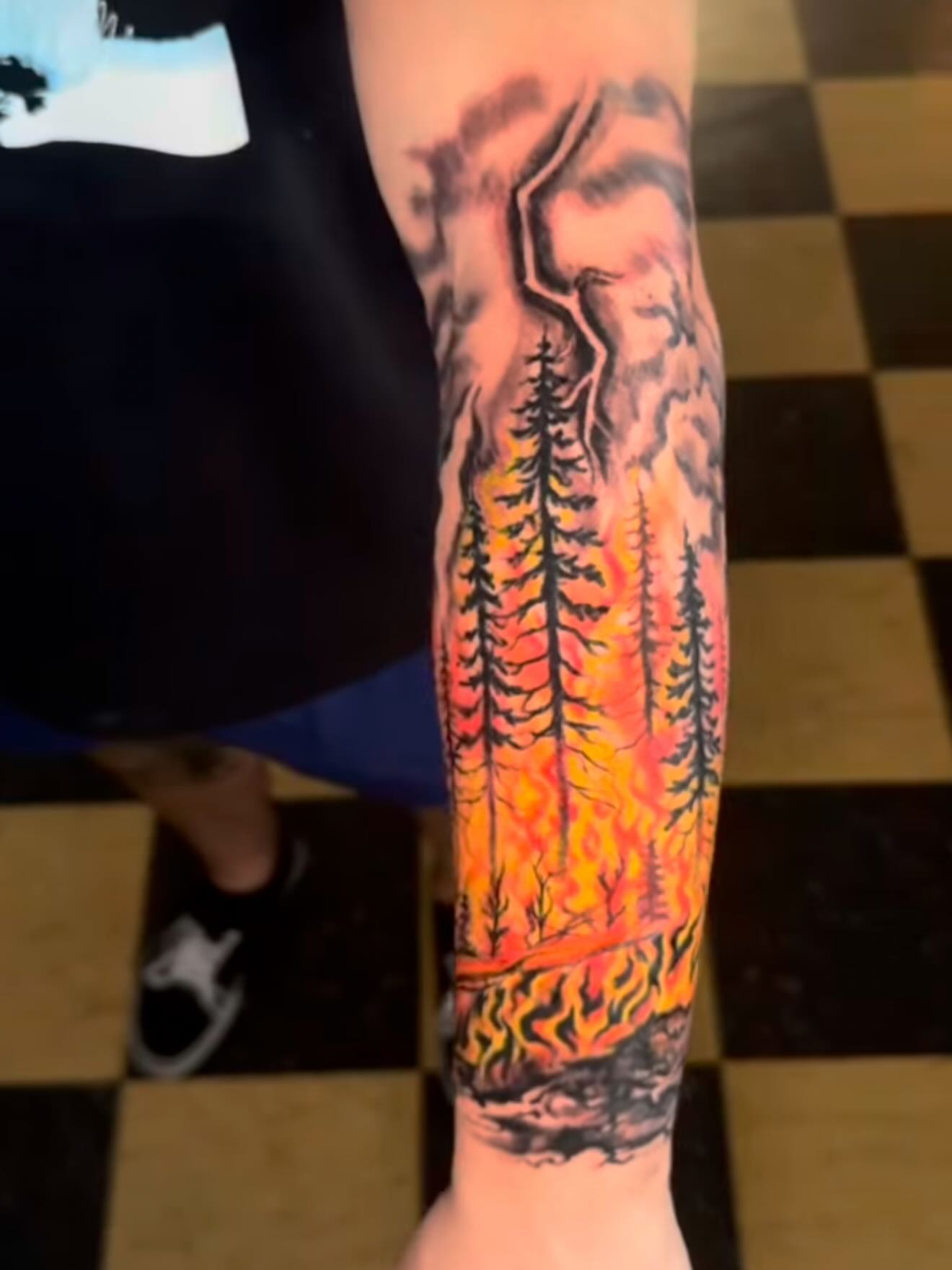 Forest fire dotwork tattoo on the forearm by Gary Chase
