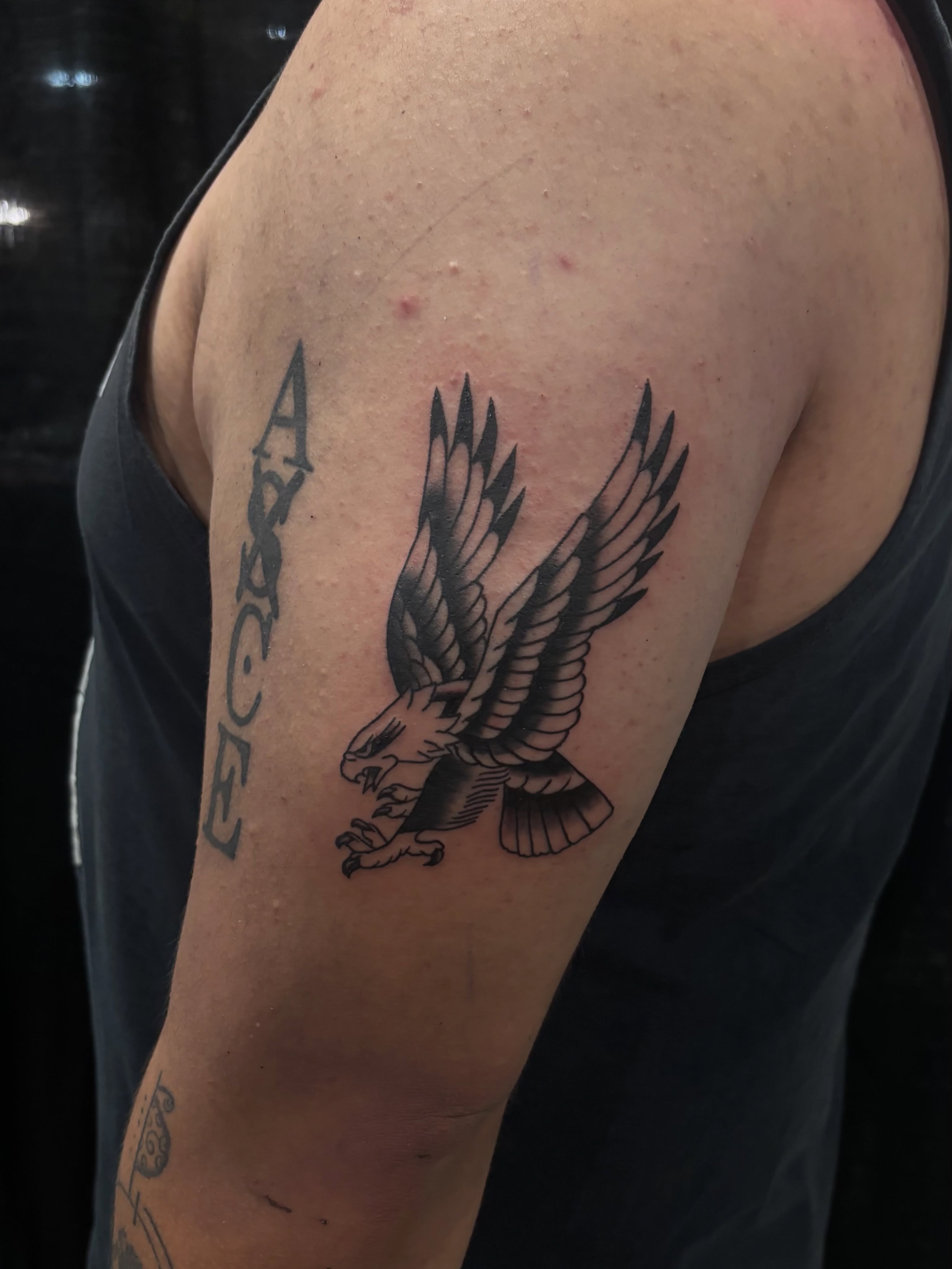 Eagle black and grey tattoo on the shoulder by Nyah Ramirez