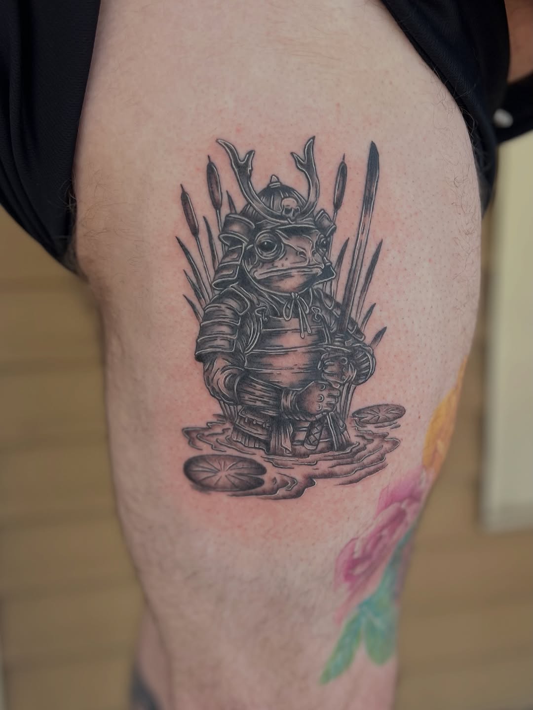 Samurai frog in water American traditional tattoo on the thigh by Jai Woods