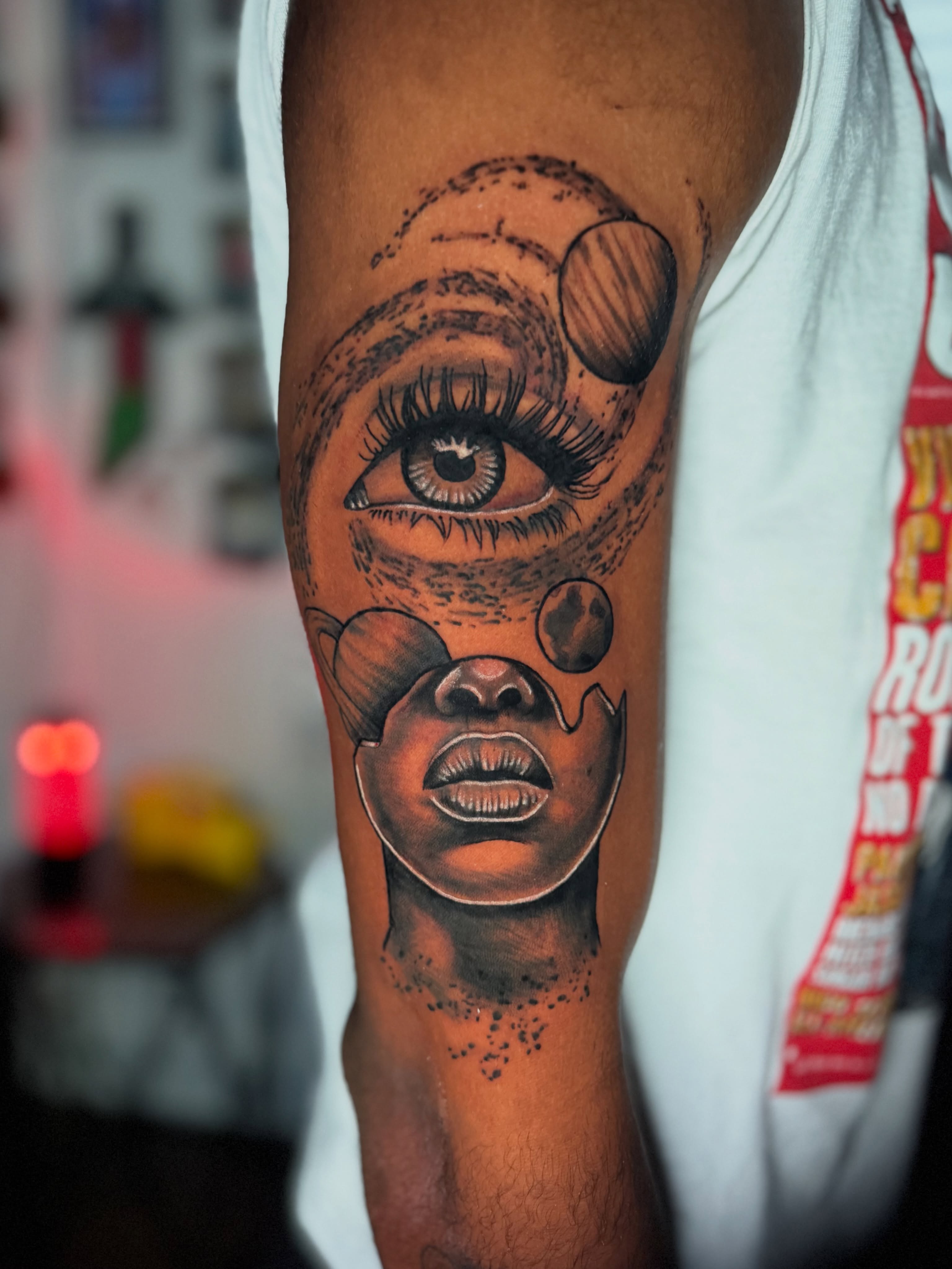 Eye and face dotwork tattoo on the forearm by Quentin Stevenson, Slidell, Louisiana
