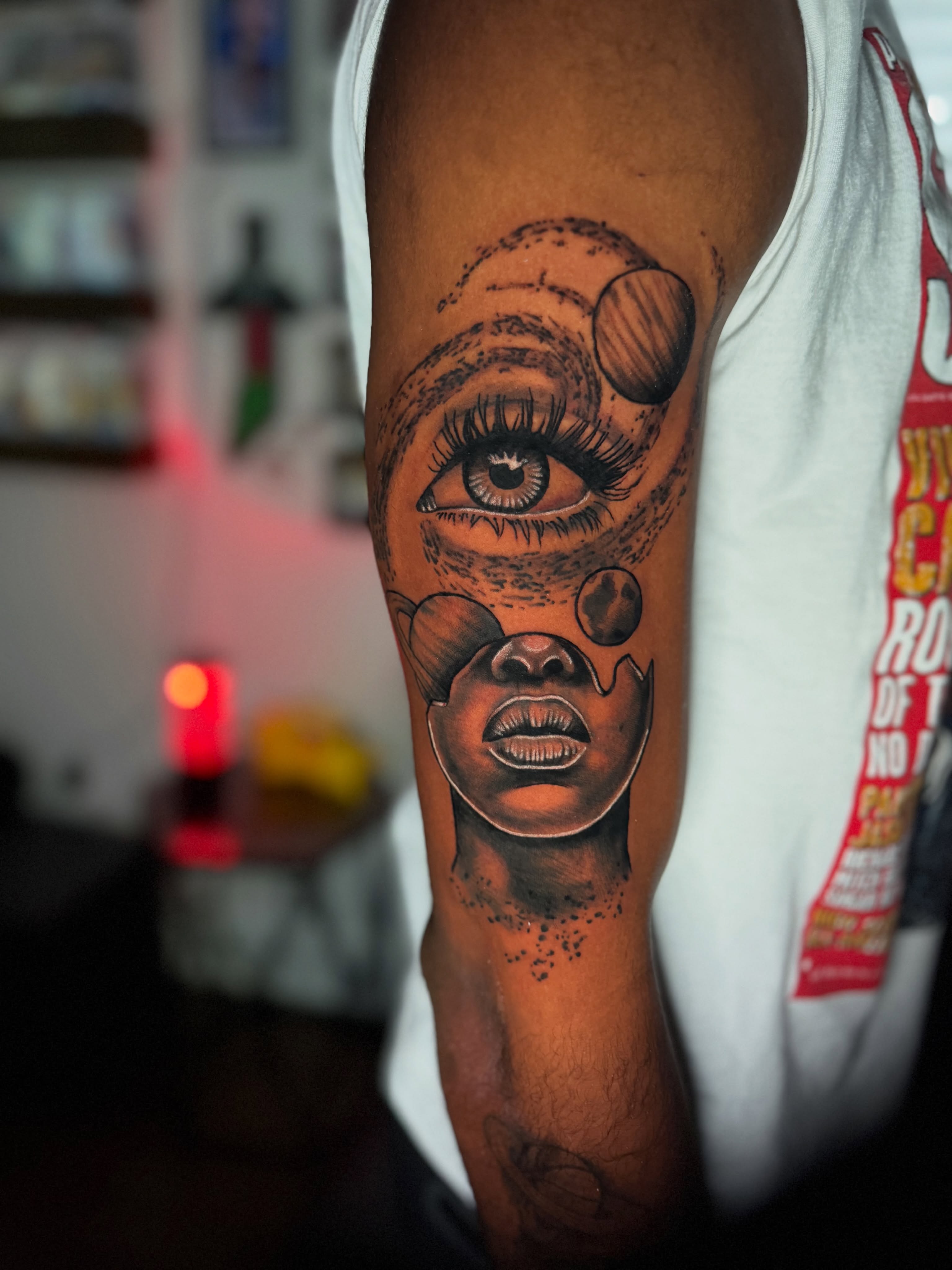 Eye and face realism tattoo on the forearm by Quentin Stevenson, Slidell, Louisiana