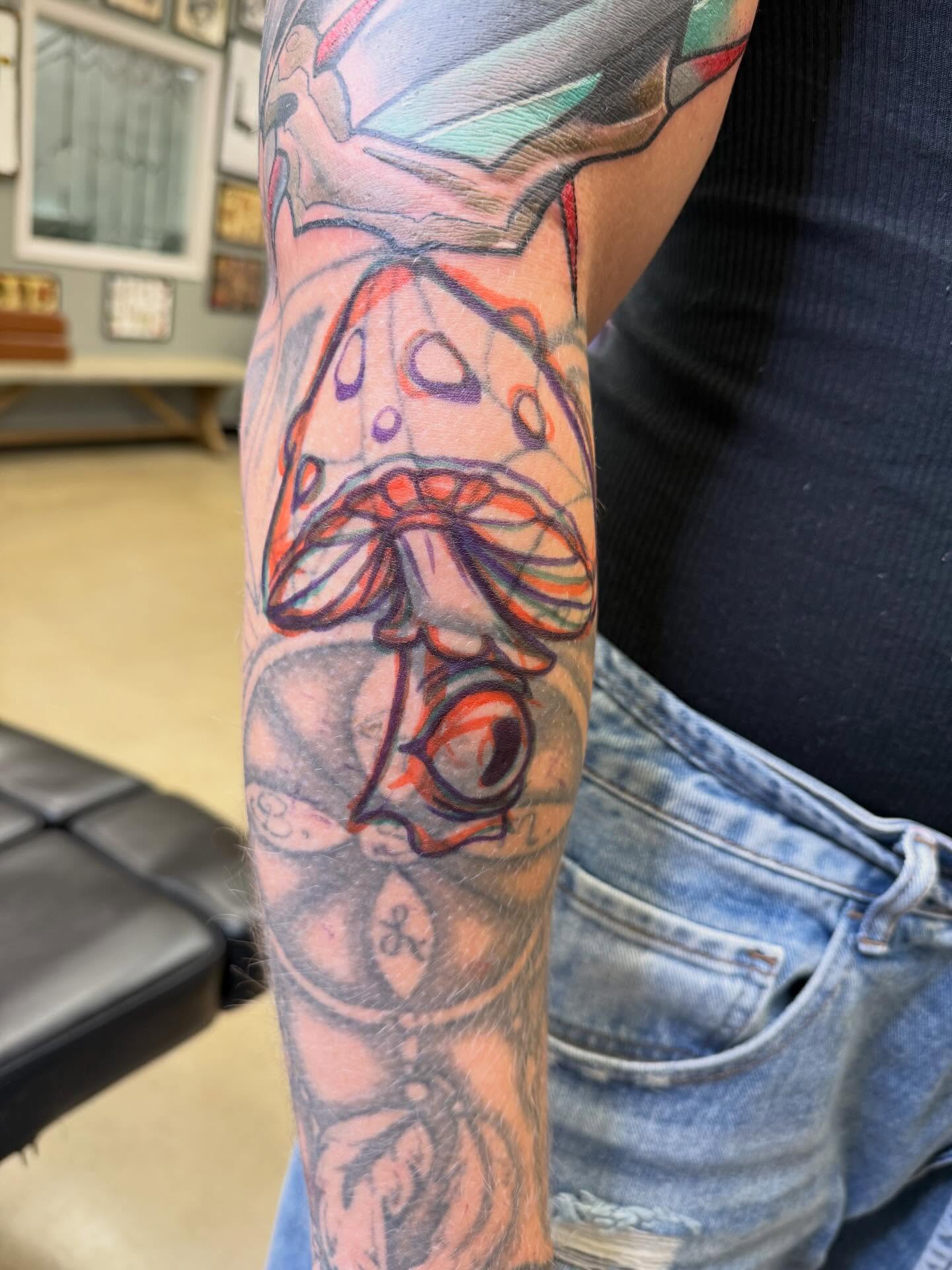 Mushroom new school tattoo on the forearm by Chris Smiseck