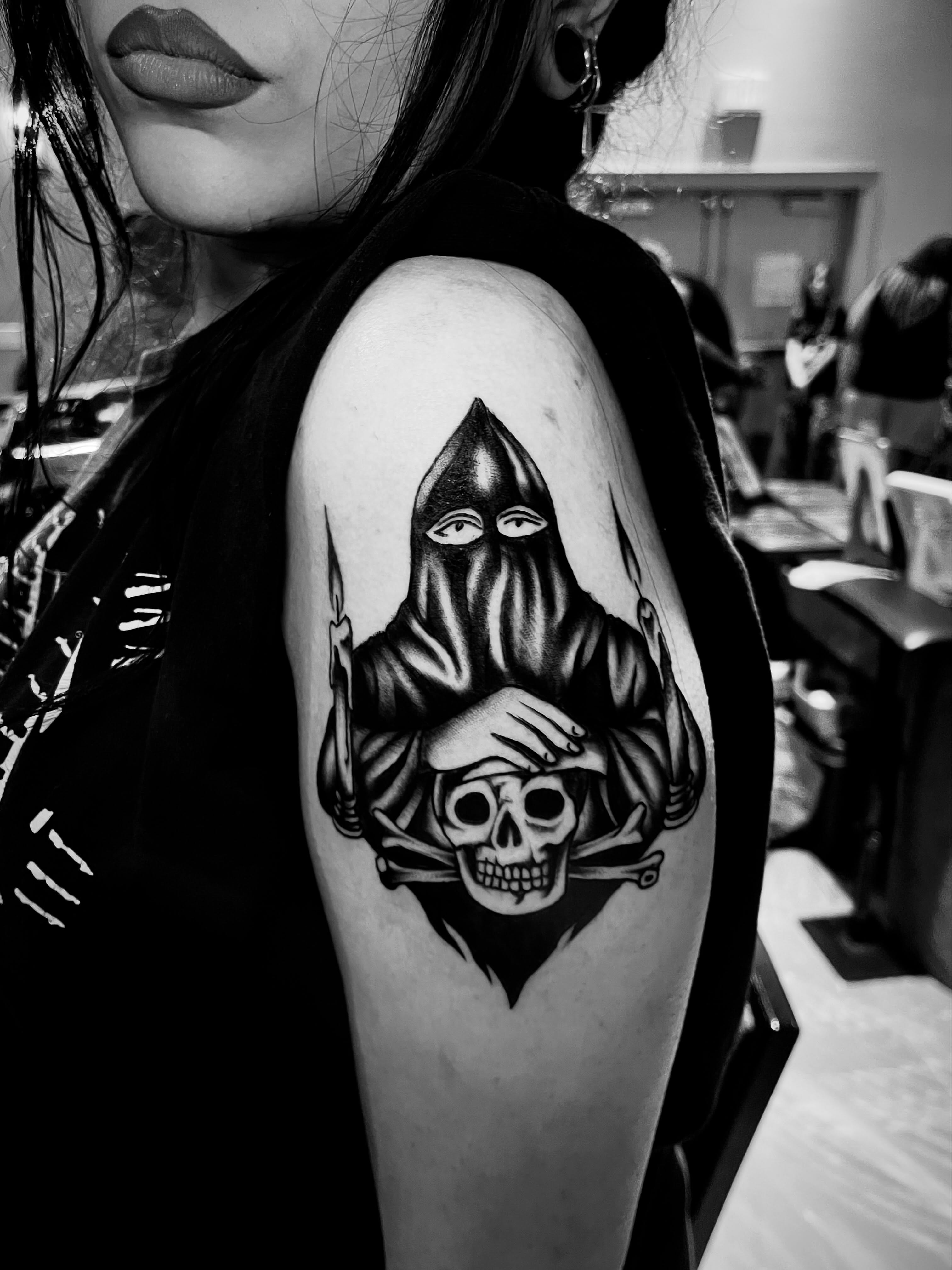 Skull and hooded figure black and grey tattoo on the shoulder by JohnJohn