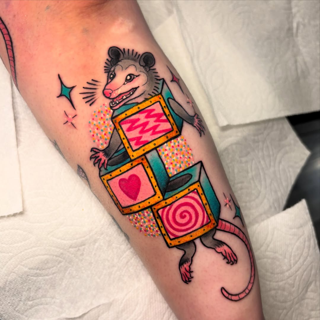 Possum with game board American traditional tattoo on the forearm by ✨REiD✨