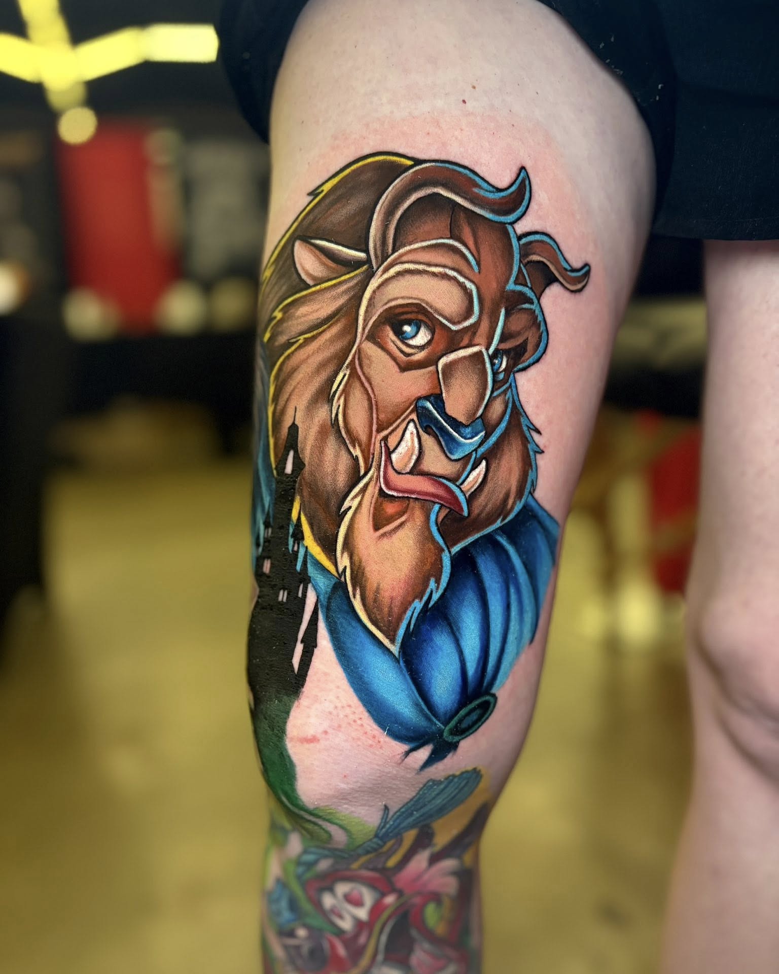 Lion American traditional tattoo on the thigh by Rachel Sellers