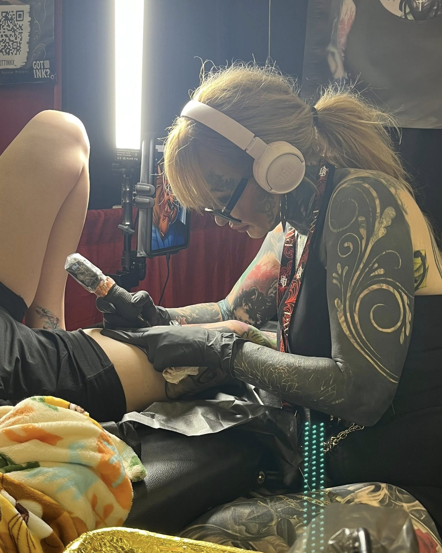 Floral design black and grey tattoo on the upper arm by Rachel Sellers