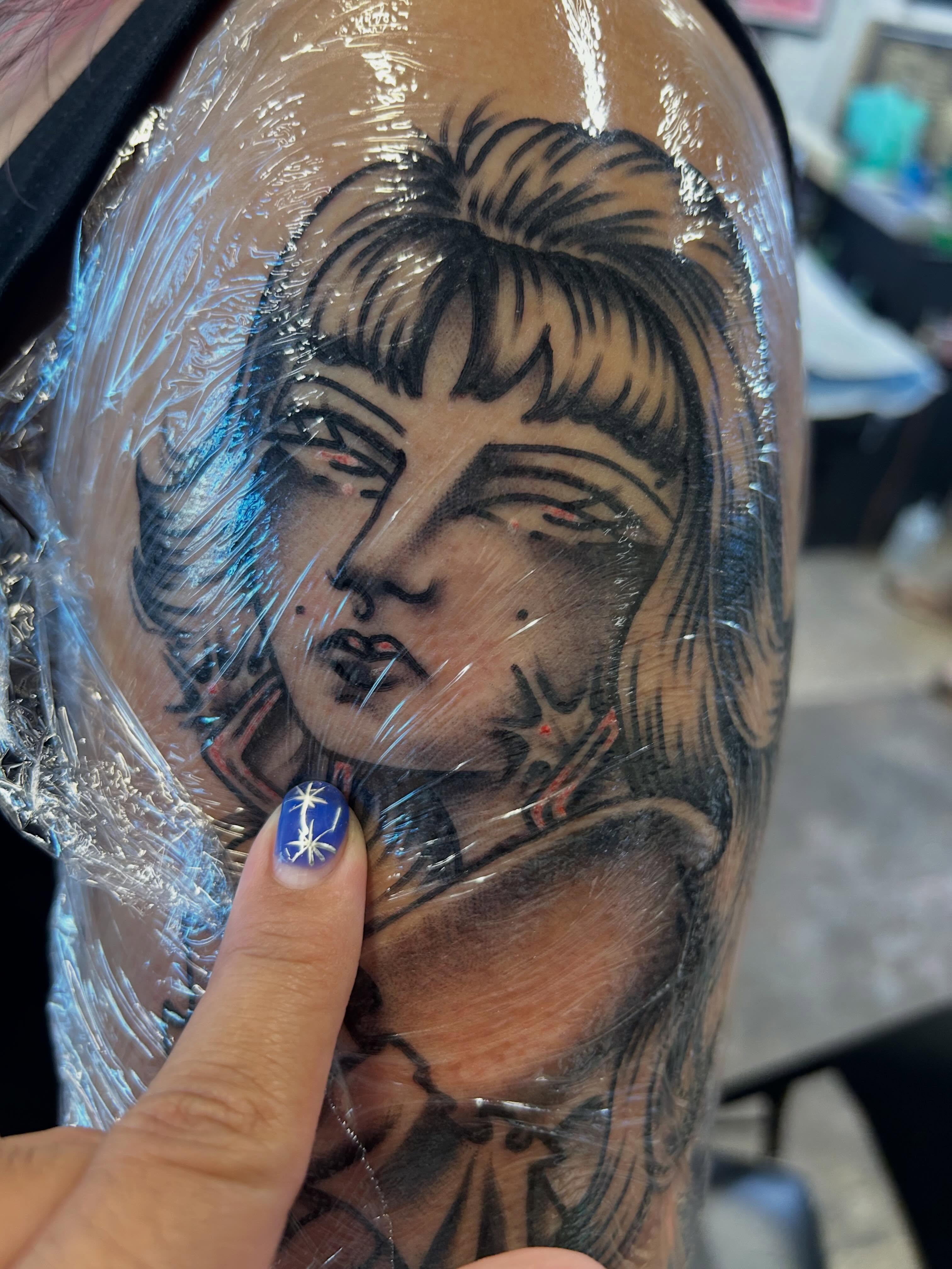 Woman's face realism tattoo on the forearm by Sanjuanita