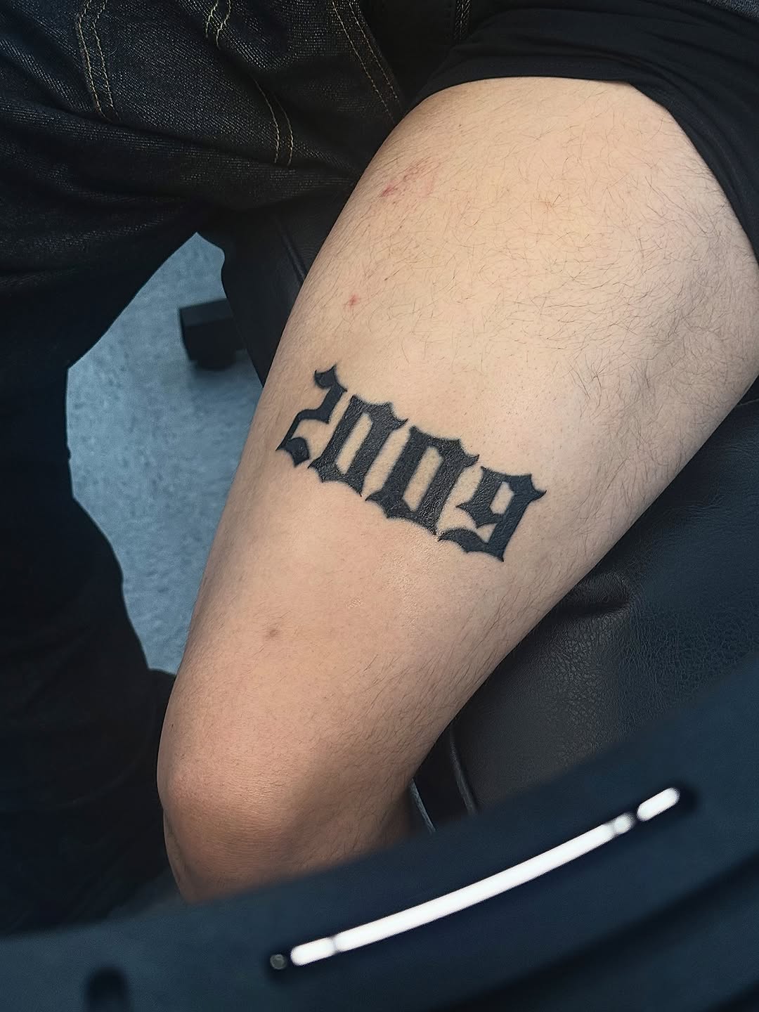 Year 2009 tattoo on the forearm by ⠀Greave
