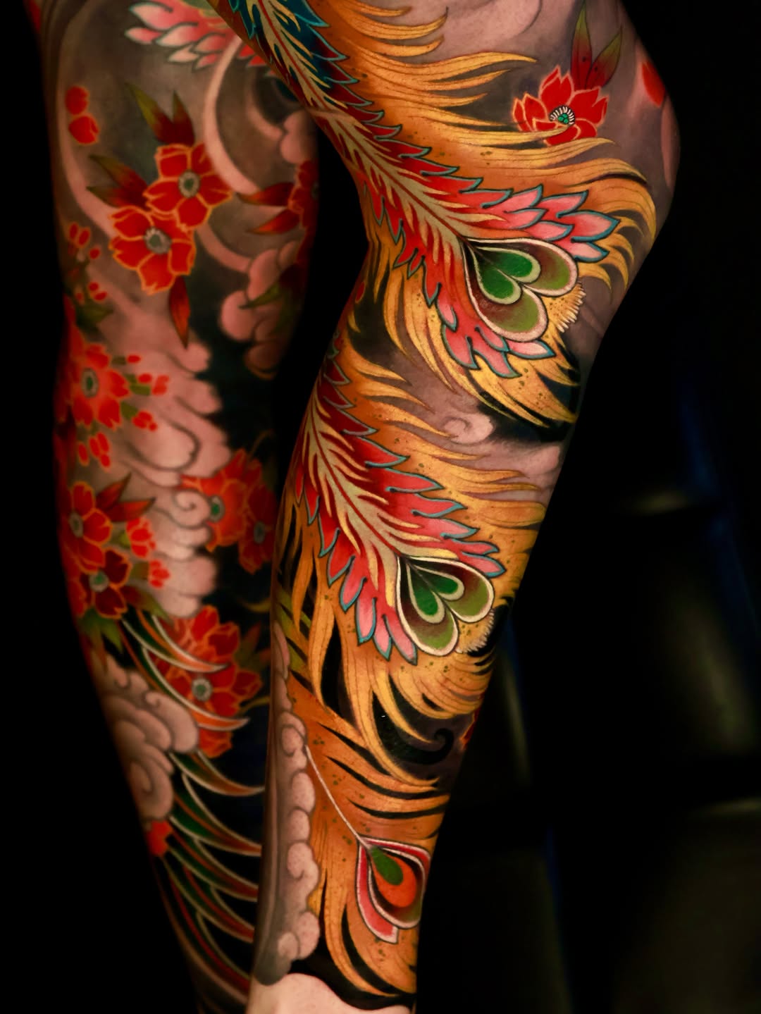 Phoenix feathers and flowers Japanese tattoo on the forearm by Hocheon