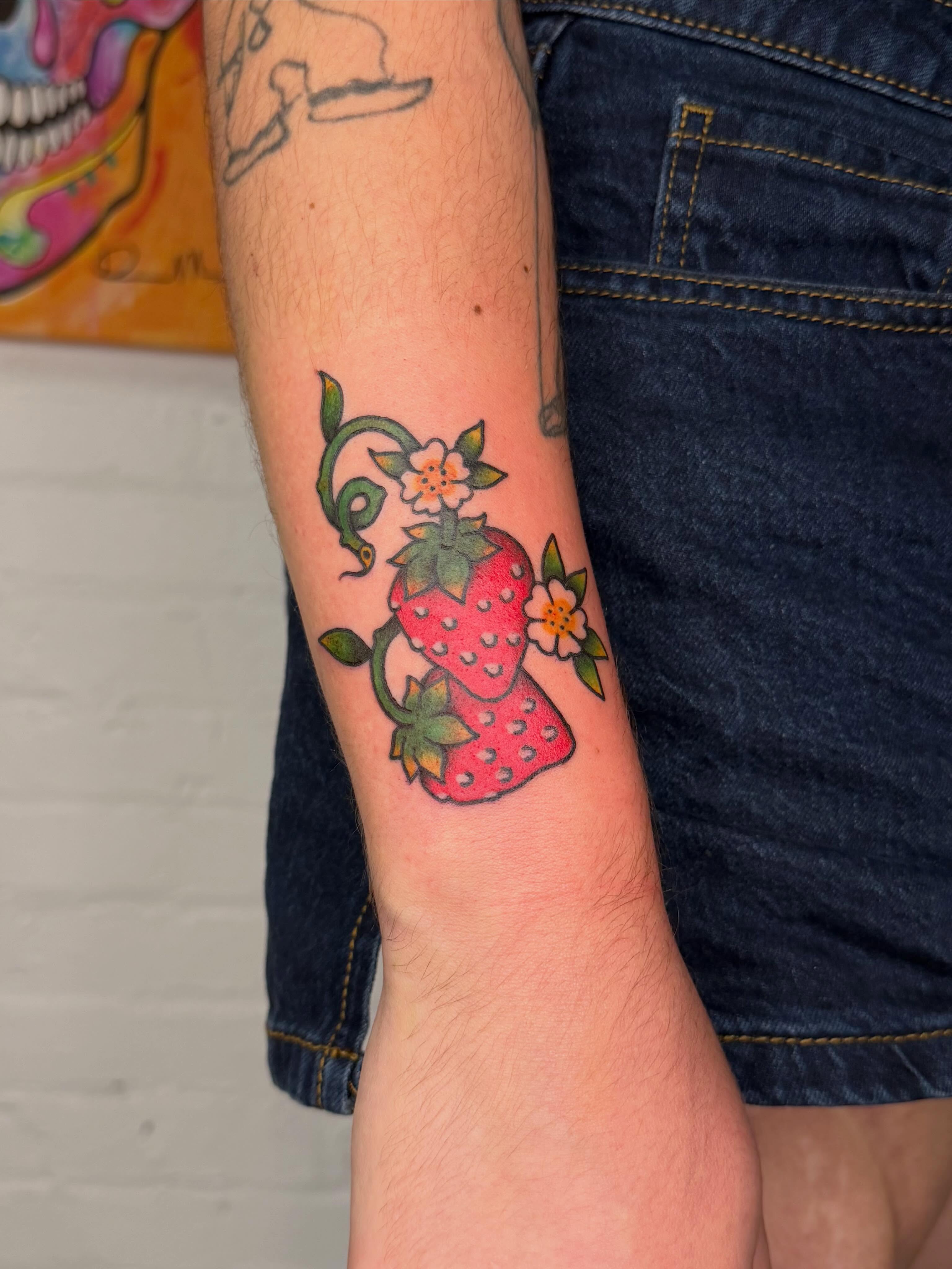Strawberry American traditional tattoo on the forearm by Dennis Patterson