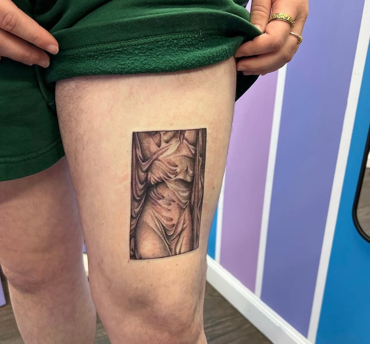 Statue black and grey tattoo on the thigh by Ebony Robinson, Austintown, Ohio