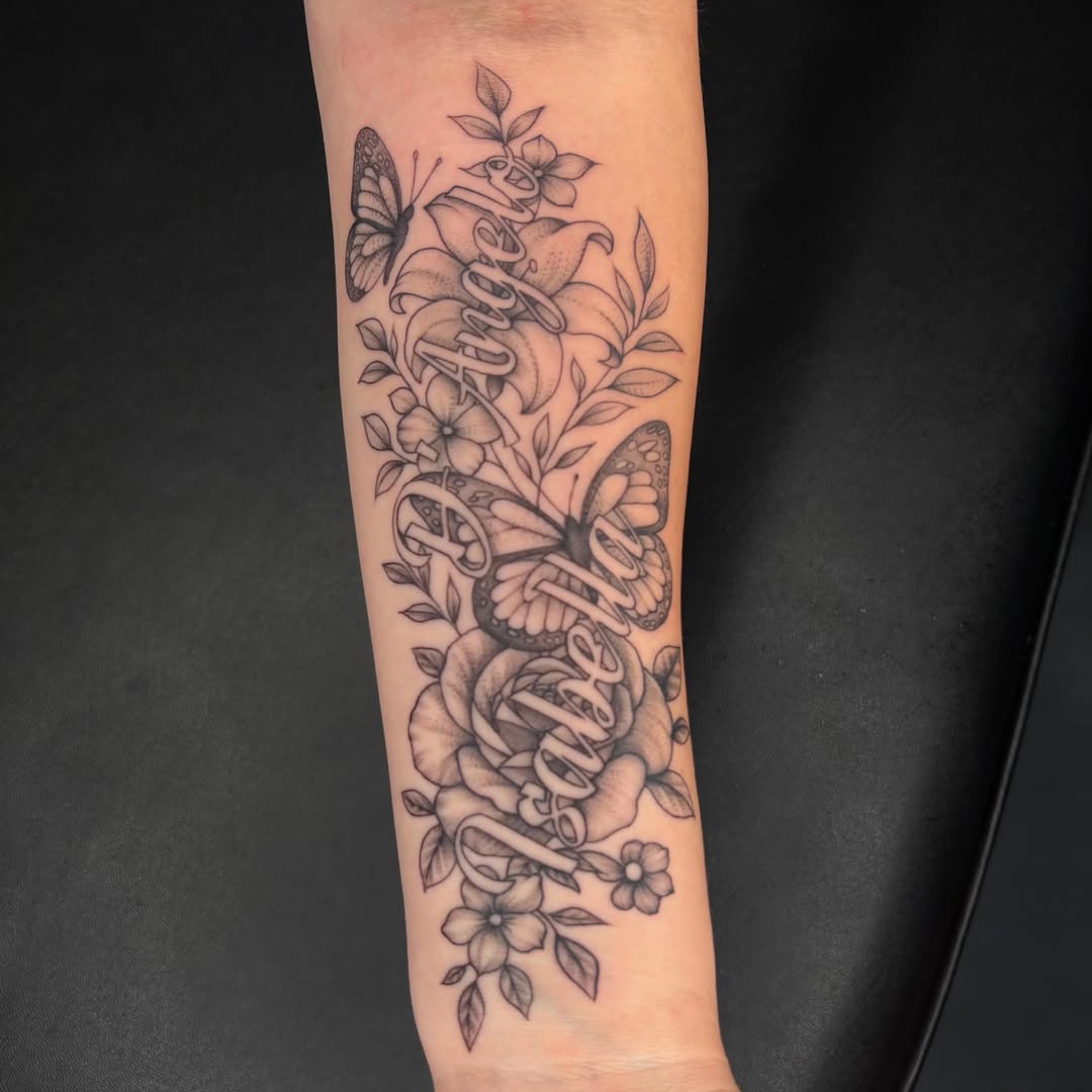 Script lettering black and grey tattoo on the forearm by Exis LHinc, Miami, Florida