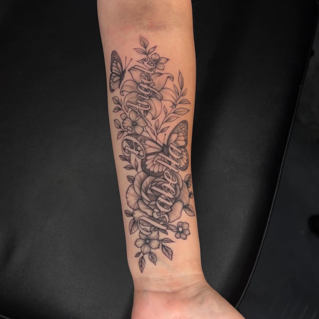 Flowers and butterflies black and grey tattoo on the forearm by Exis LHinc, Miami, Florida
