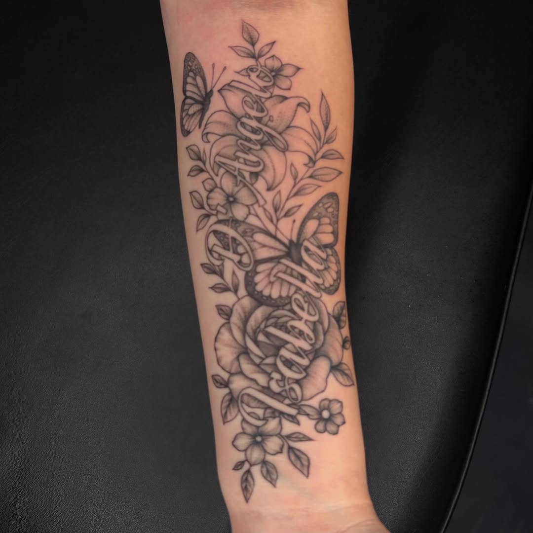 Butterfly and floral realism tattoo on the forearm by Exis LHinc, Miami, Florida