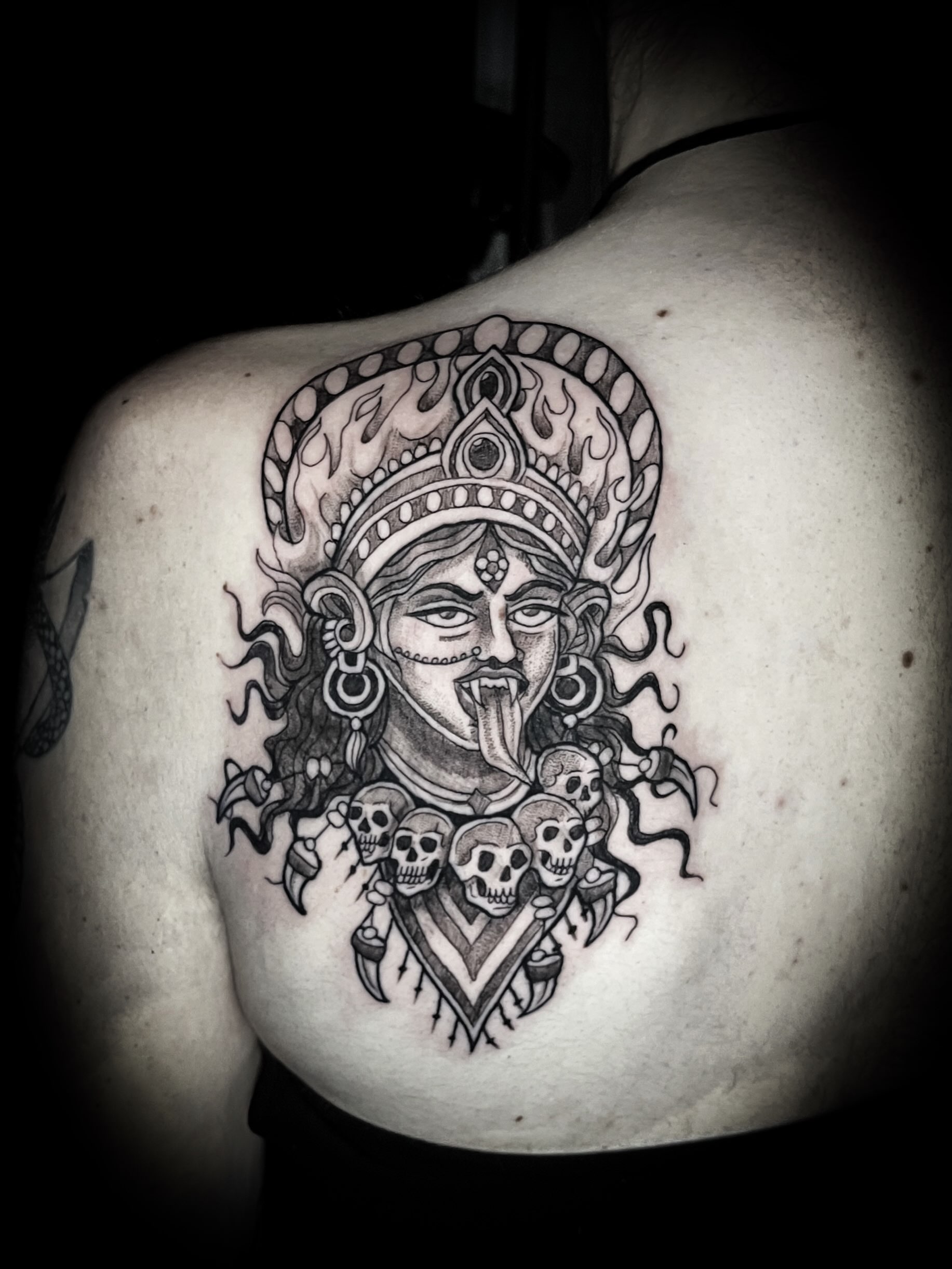 Demon lord with skulls black and grey tattoo on the back by Lindsay Fernandez, Colorado Springs, Colorado