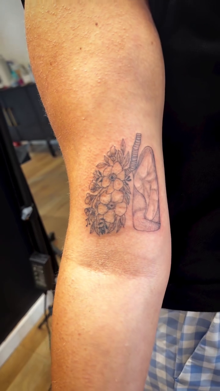 Lungs with floral elements minimalist tattoo on the forearm by TolzinInk, Brookings, South Dakota