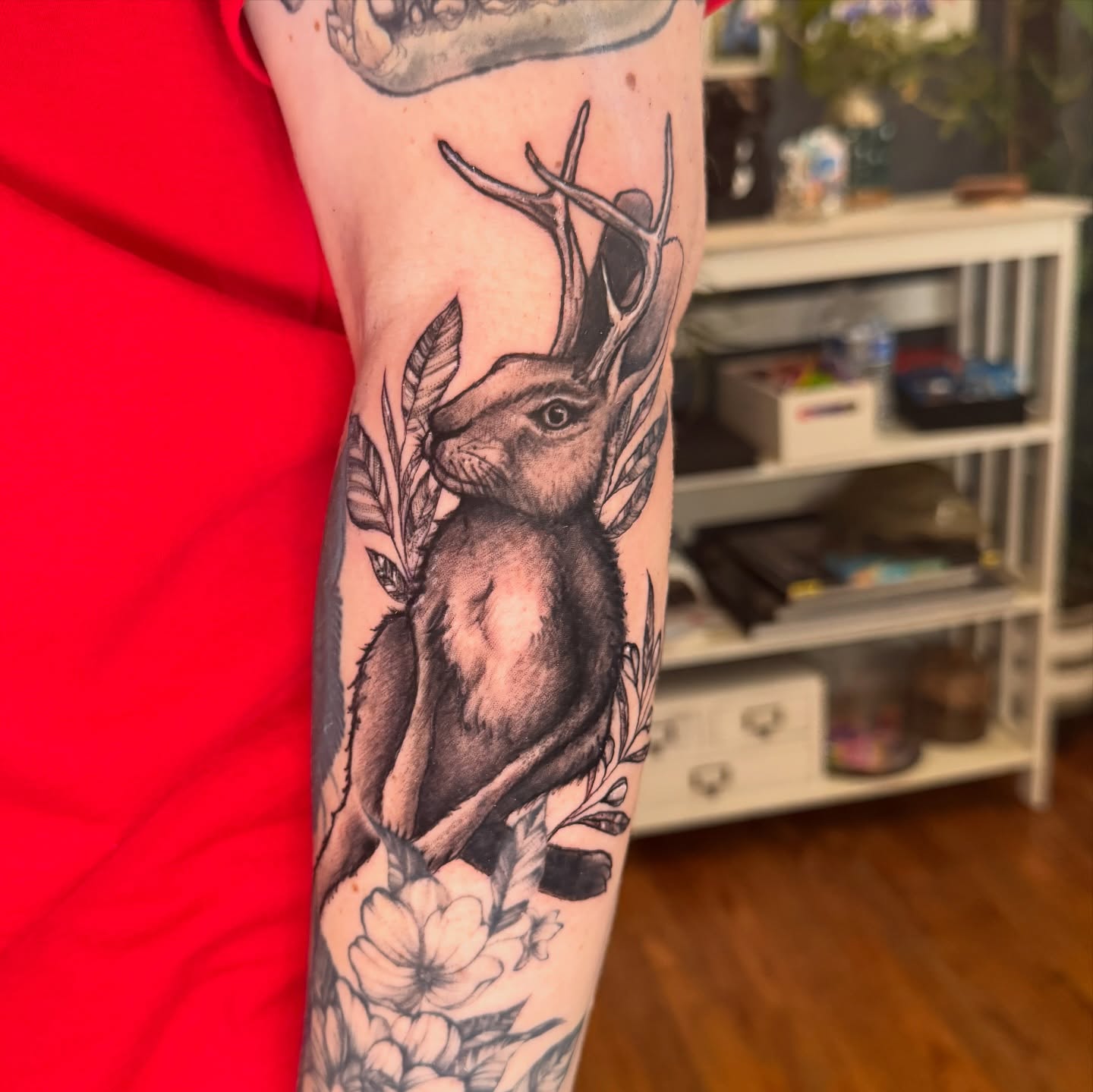 Deer with floral elements realism tattoo on the forearm by Eric Burns - NoVA Tattoo Artist