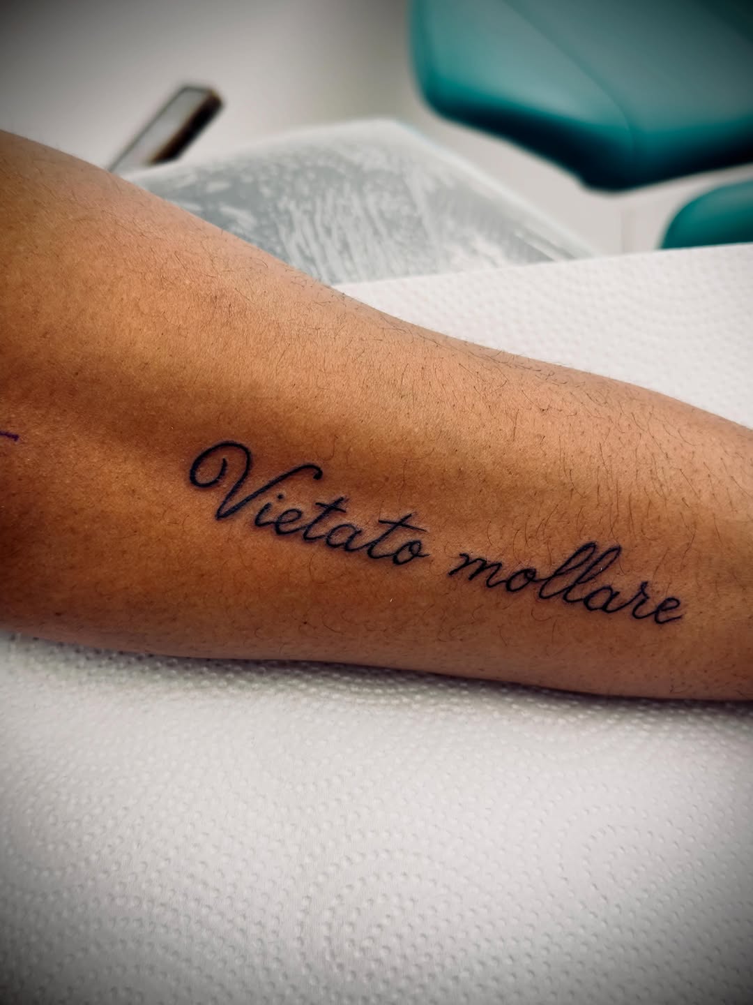 Script lettering lettering tattoo on the forearm by Salvador Mendoza, Sesto San Giovanni