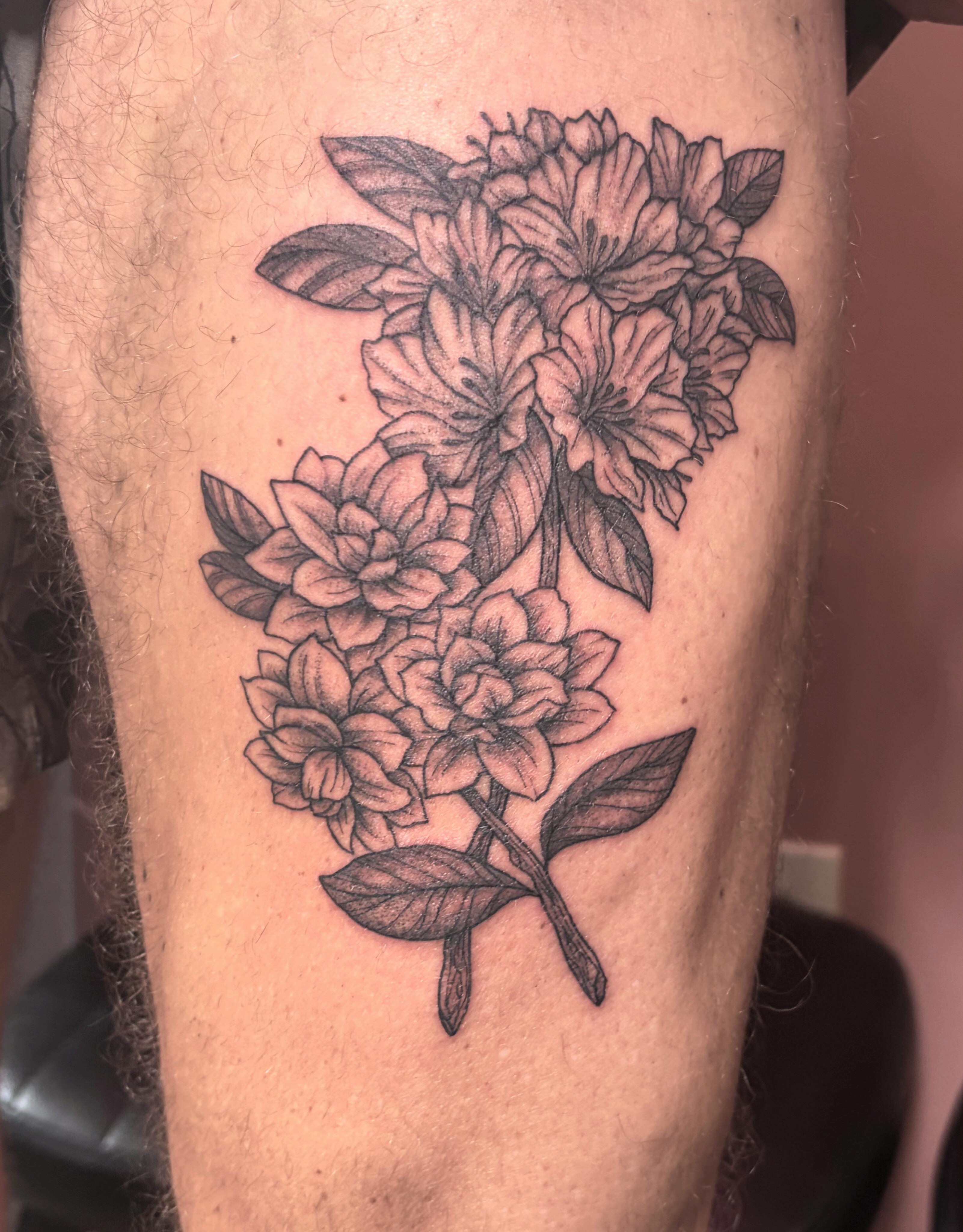 Flower bouquet black and grey tattoo on the forearm by Mary Hannah Sosdian