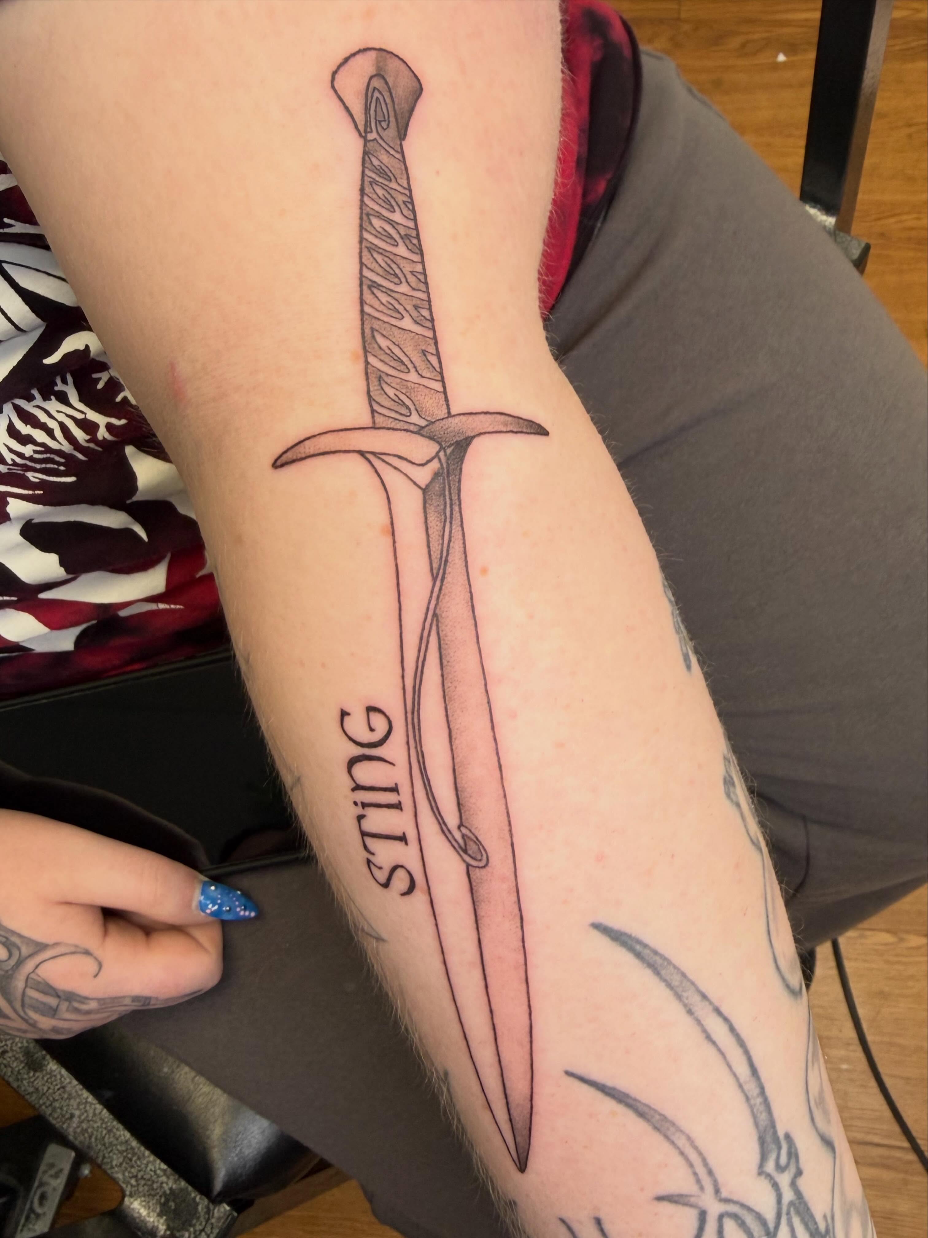 Sword black and grey tattoo on the forearm by Rebecca (Becca) Ray