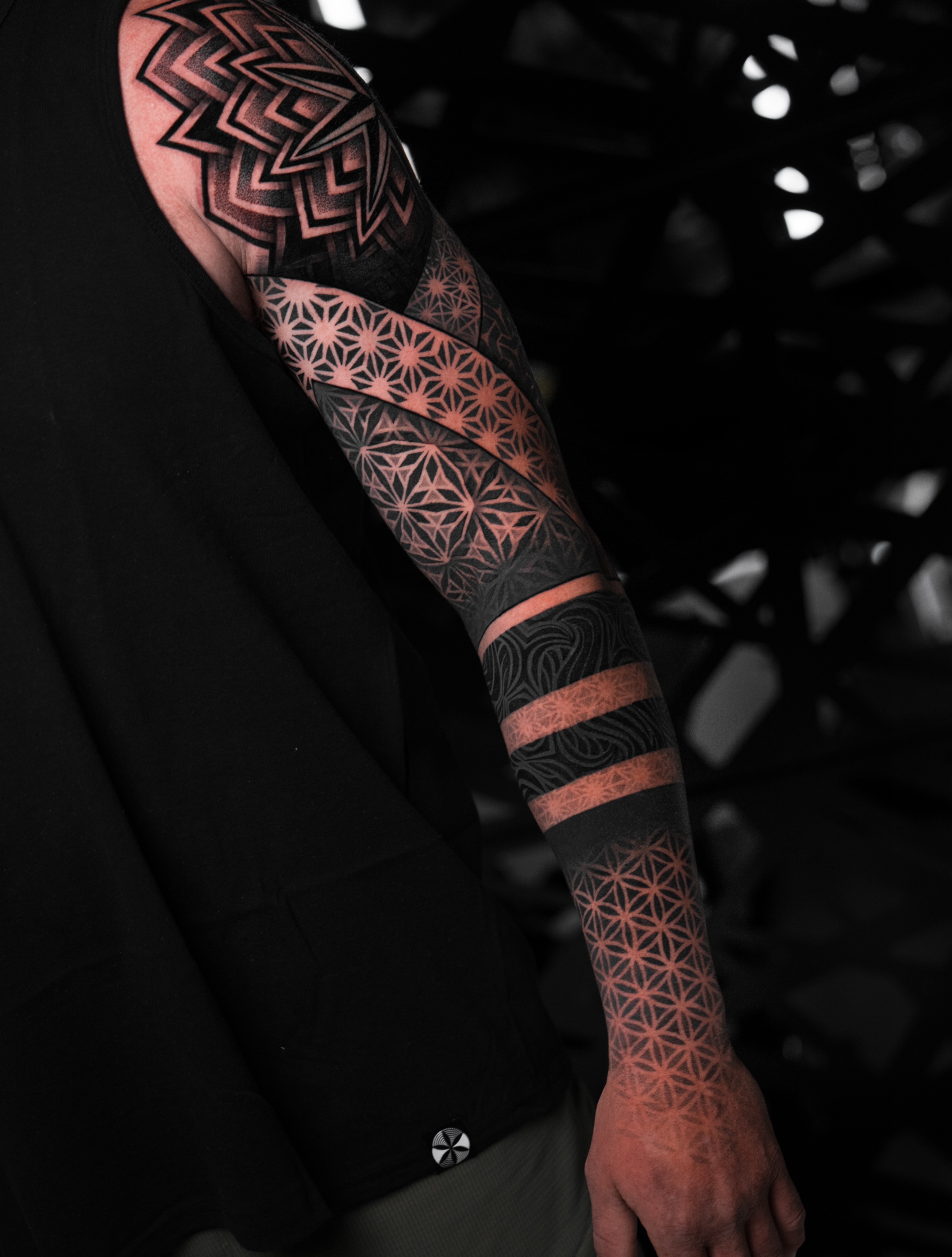 Geometric patterns geometric tattoo on the upper arm by Ilya Cascad Kandaurov