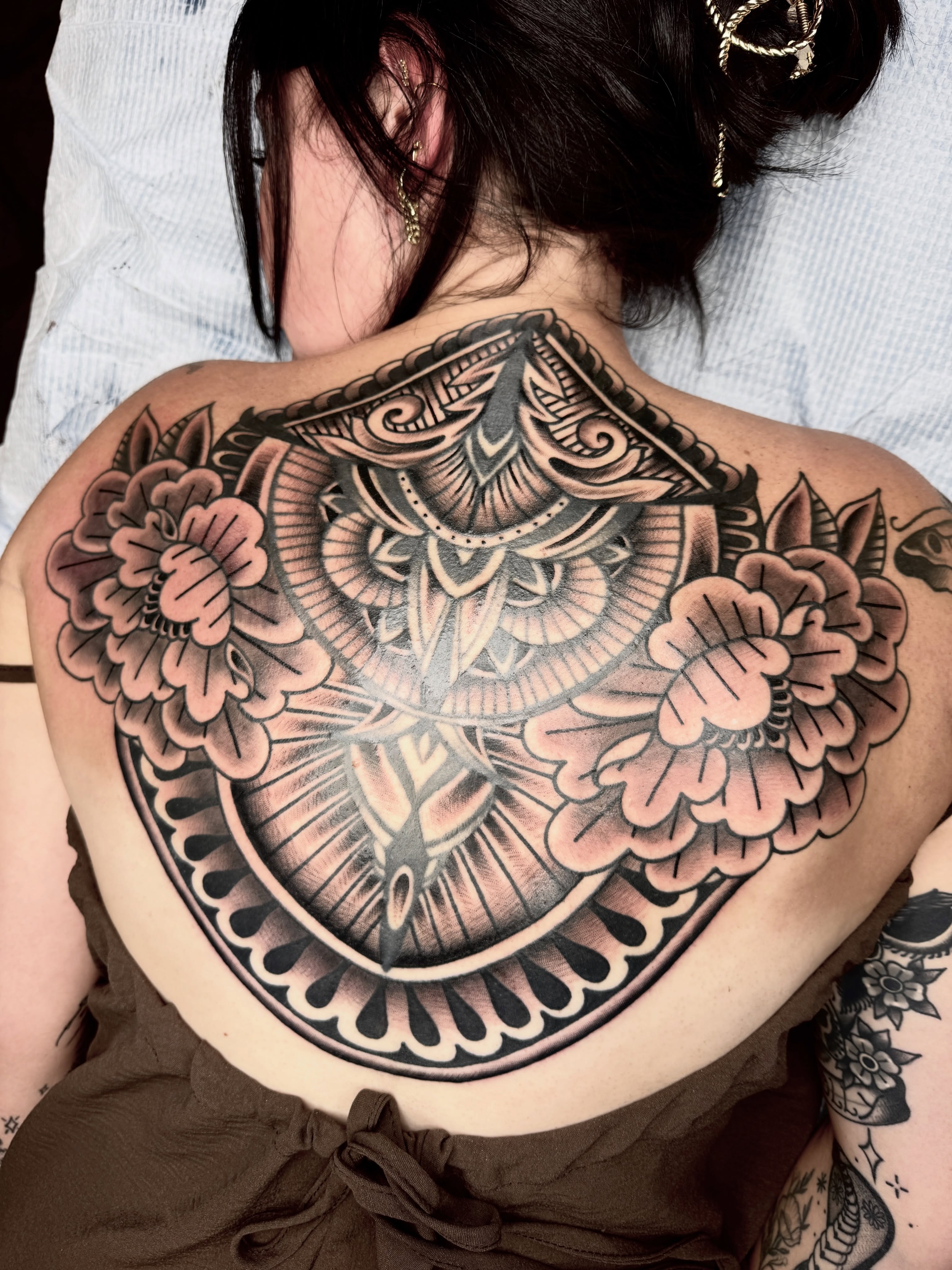 Peony and bird American traditional tattoo on the back by Butch Mickle