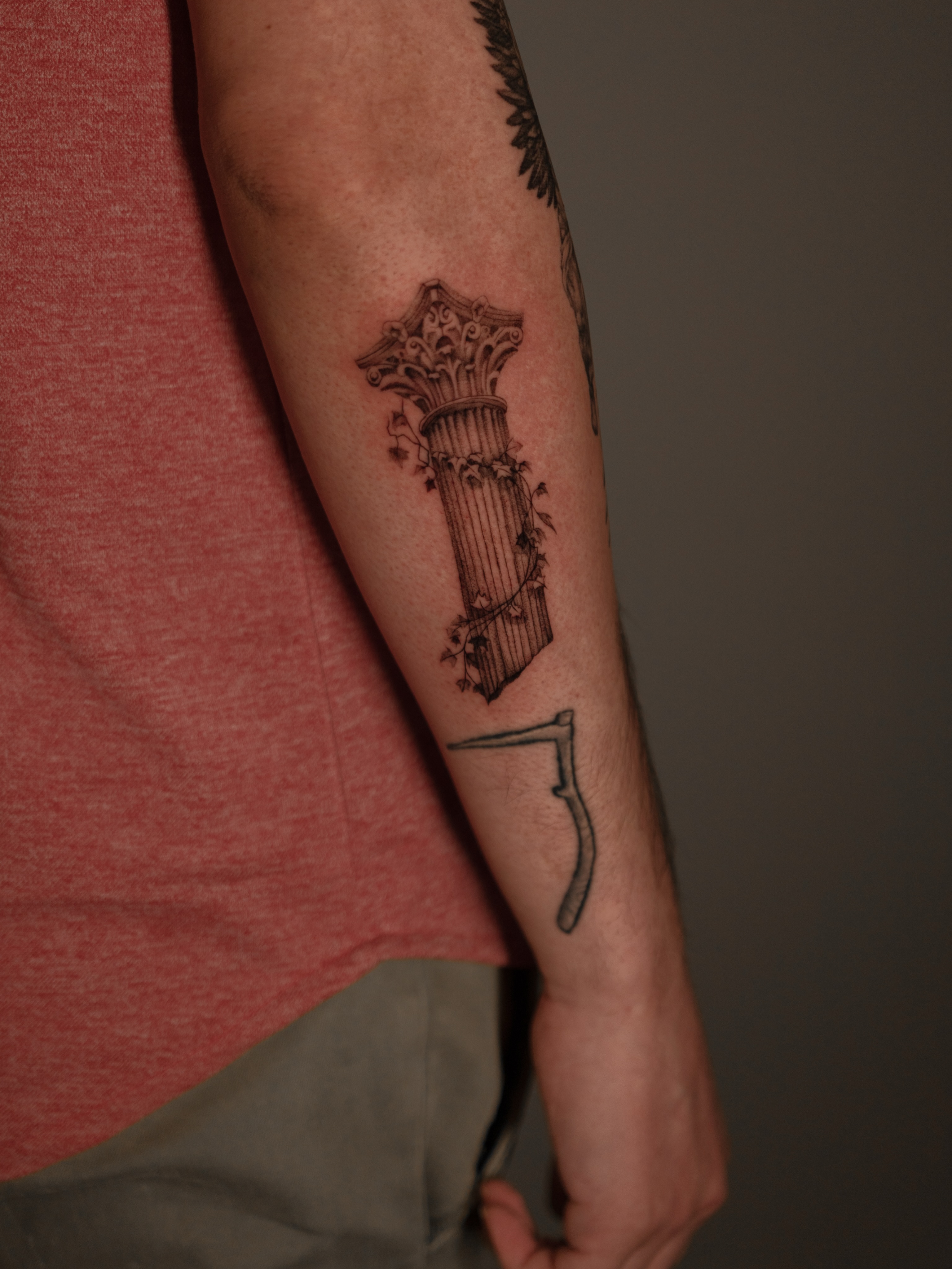 Column black and grey tattoo on the forearm by Jen- San Antonio tattoo artist