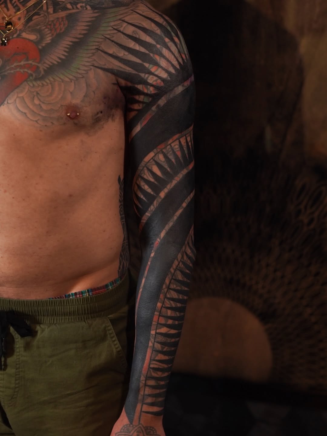 Full sleeve abstract blackwork tribal tattoo on the upper arm by Oliver kenton, San Diego, California