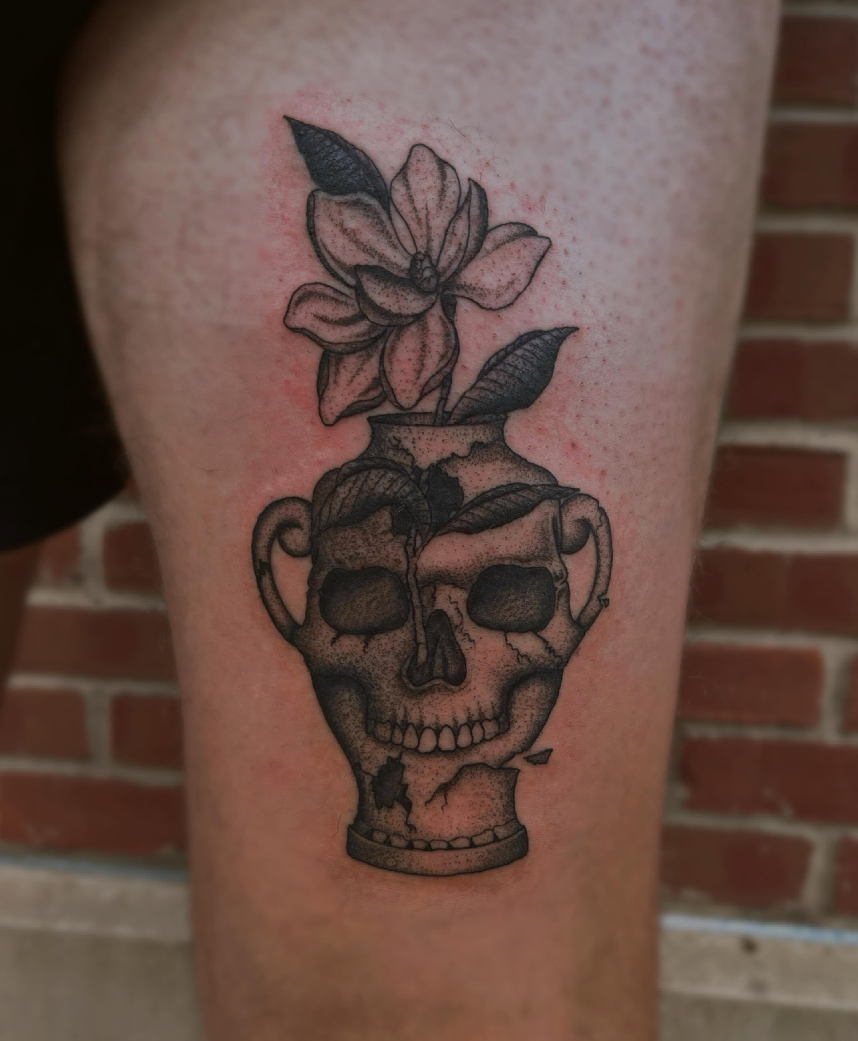 Skull vase with flower dotwork tattoo on the thigh by Jackson Kirchhoff