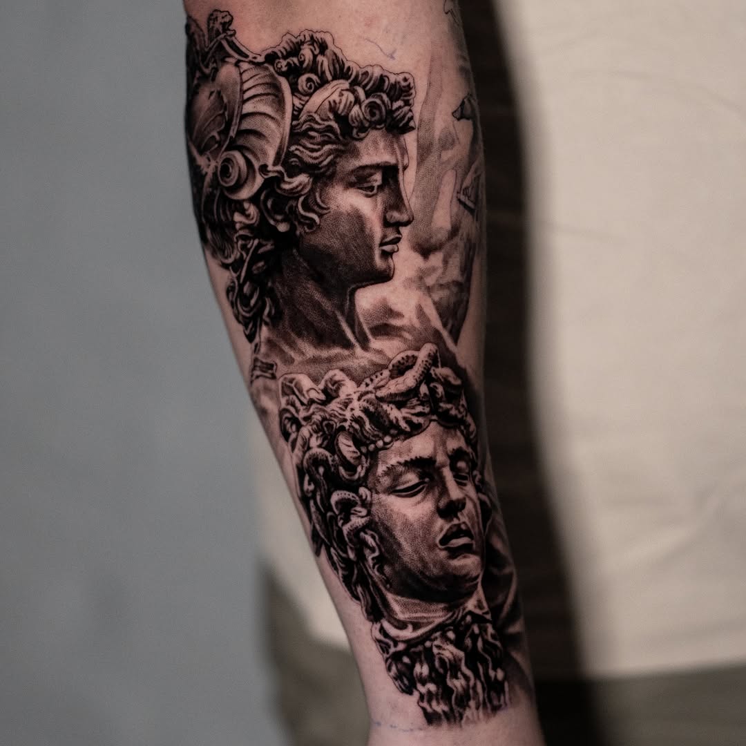 Greek statues surrealism tattoo on the forearm by Mark Vata