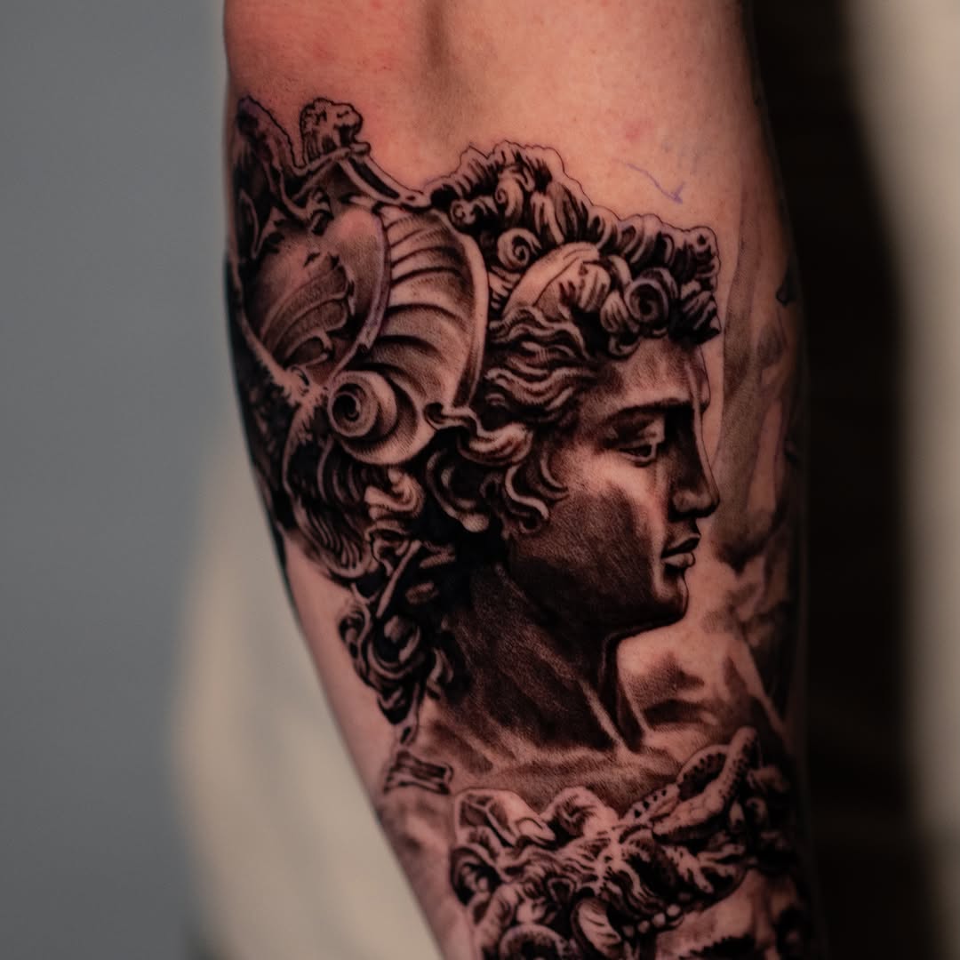 Bust of a classical sculpture realism tattoo on the forearm by Mark Vata