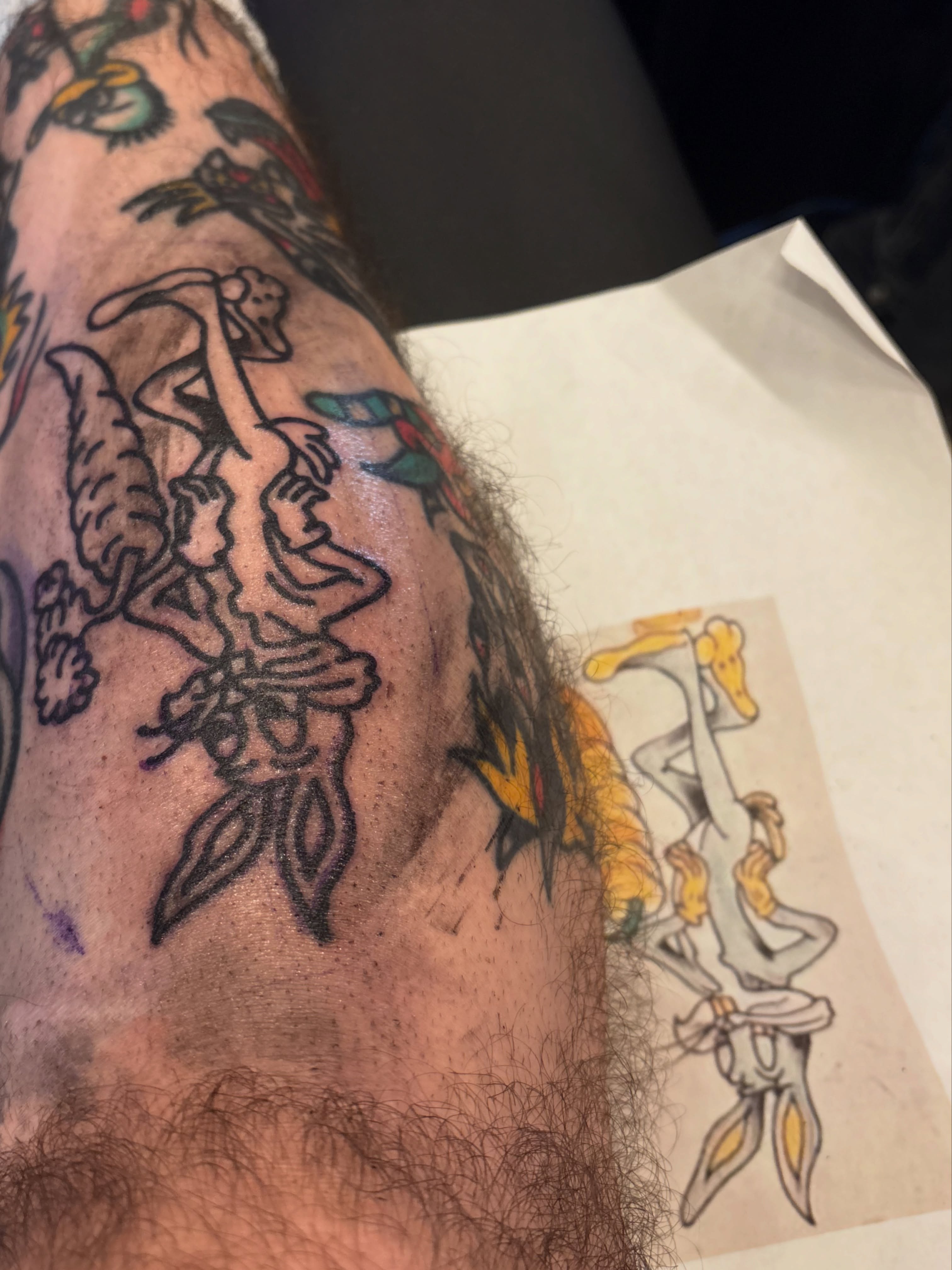 Hare and rabbit American traditional tattoo on the forearm by Andrew Silva