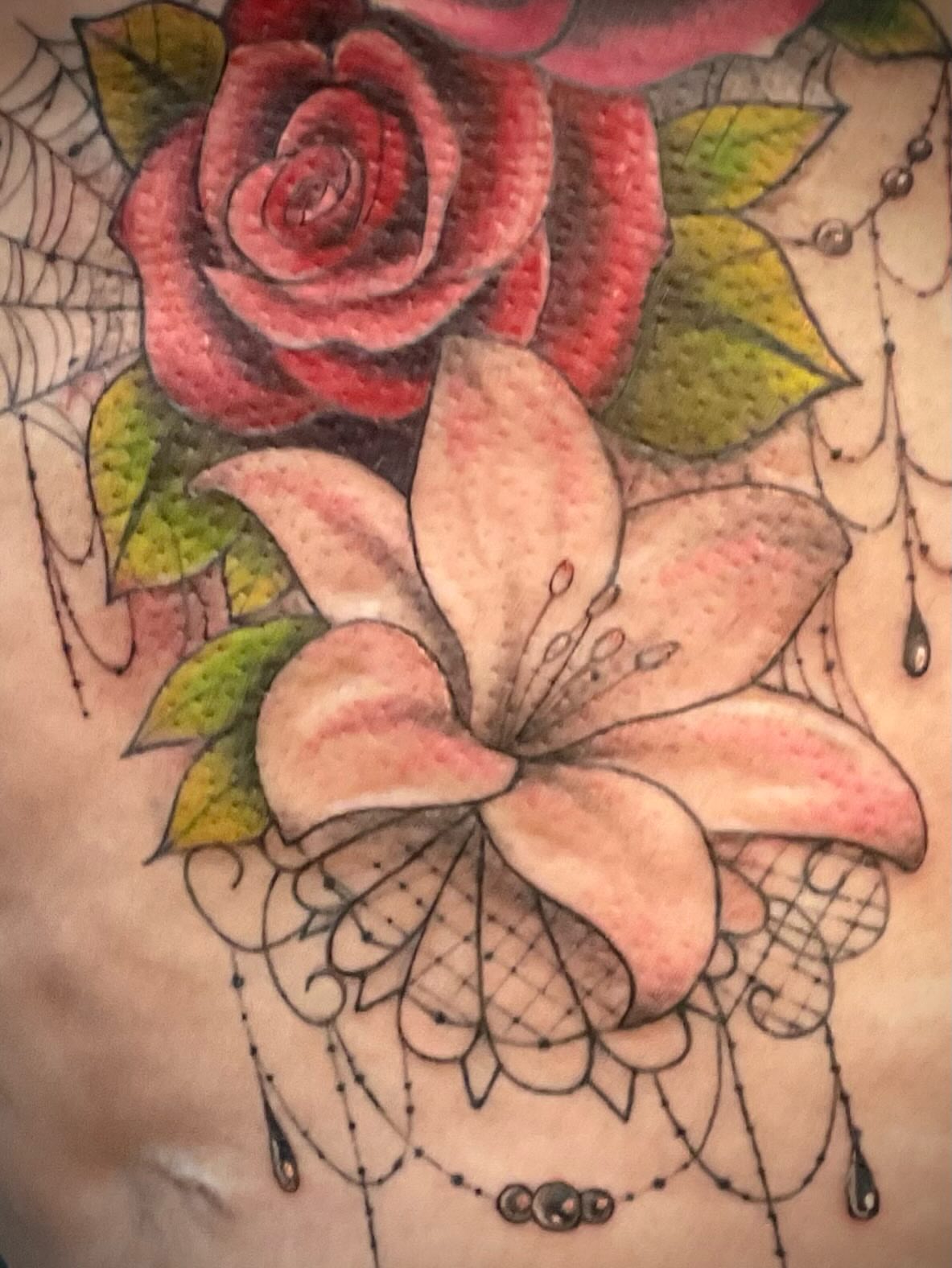 Flower bouquet dotwork tattoo on the chest by Freya Petersen